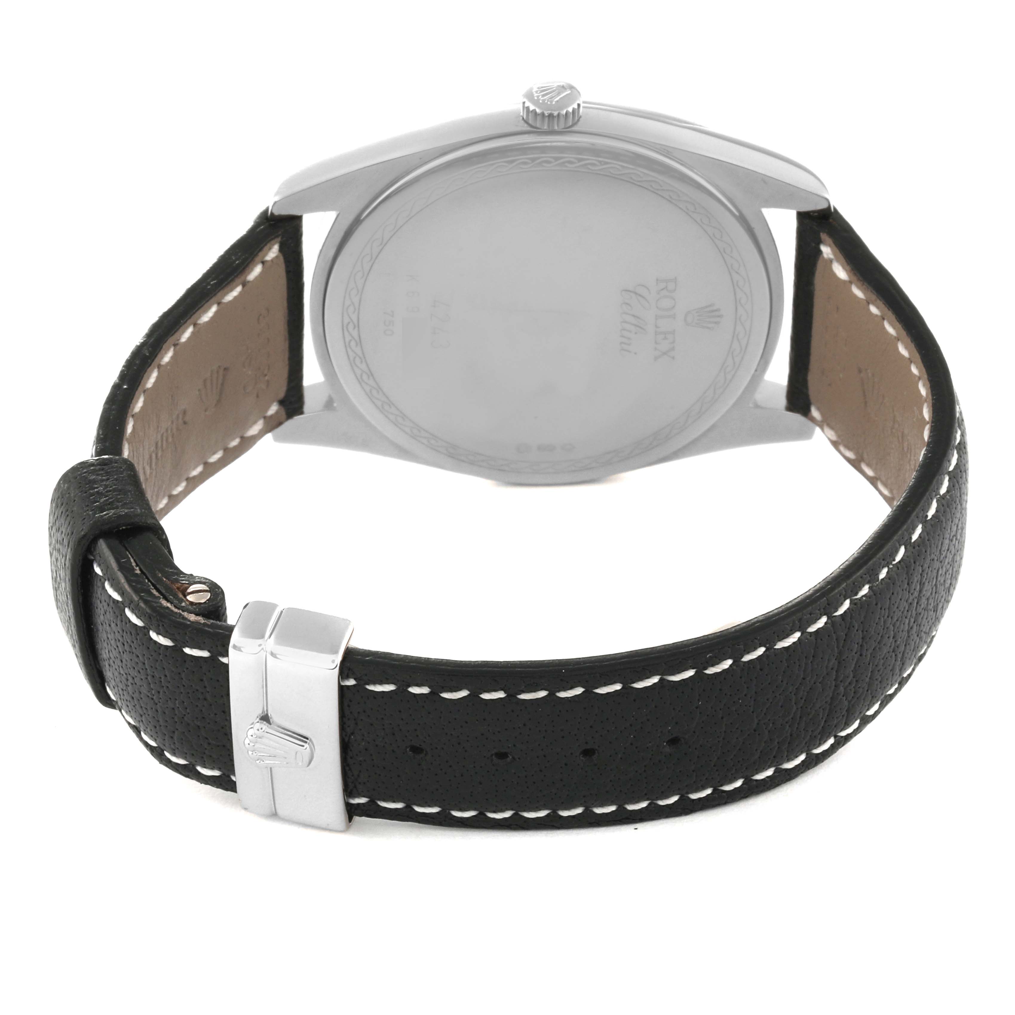 This image shows the back view of a Rolex Cellini 4243/9 Men
s White Gold Silver Dial 4243/9 Men
s White Gold Silver Dial watch, highlighting its leather strap and buckle.