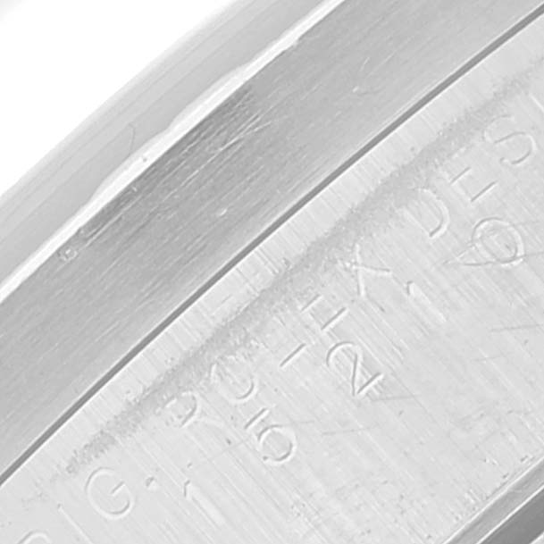 This close-up image shows the engraved lettering on the caseback of a Rolex Date 15210 Men
s Stainless Steel Blue Dial 15210 Men
s Stainless Steel Blue Dial model watch.