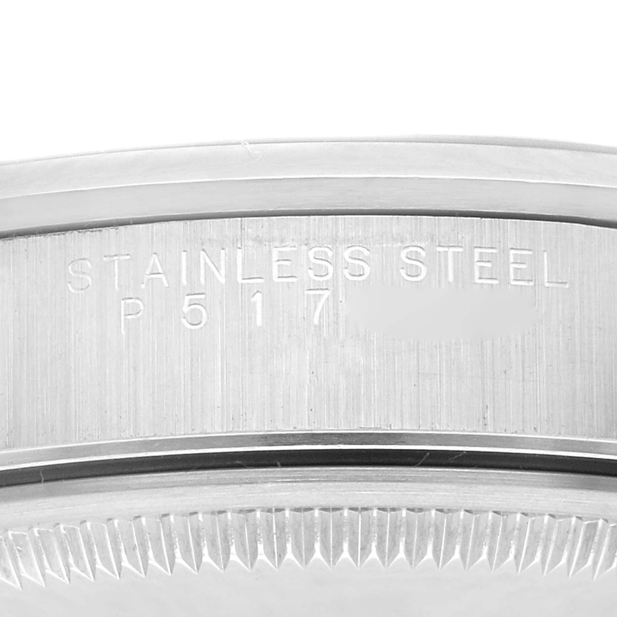 This macro shot shows the outer rim and lug area of the Rolex Date 15200 Men's Stainless Steel Blue Dial 15200 Men's Stainless Steel Blue Dial model, highlighting the "STAINLESS STEEL" engraving.