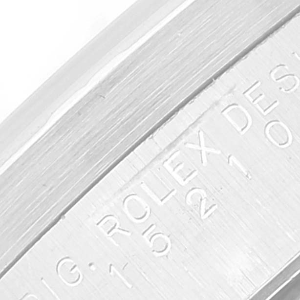 This close-up image shows the engraved text on the inner bezel (rehaut) of a Rolex Date 15210 Men's Stainless Steel Pink Dial 15210 Men's Stainless Steel Pink Dial model watch.