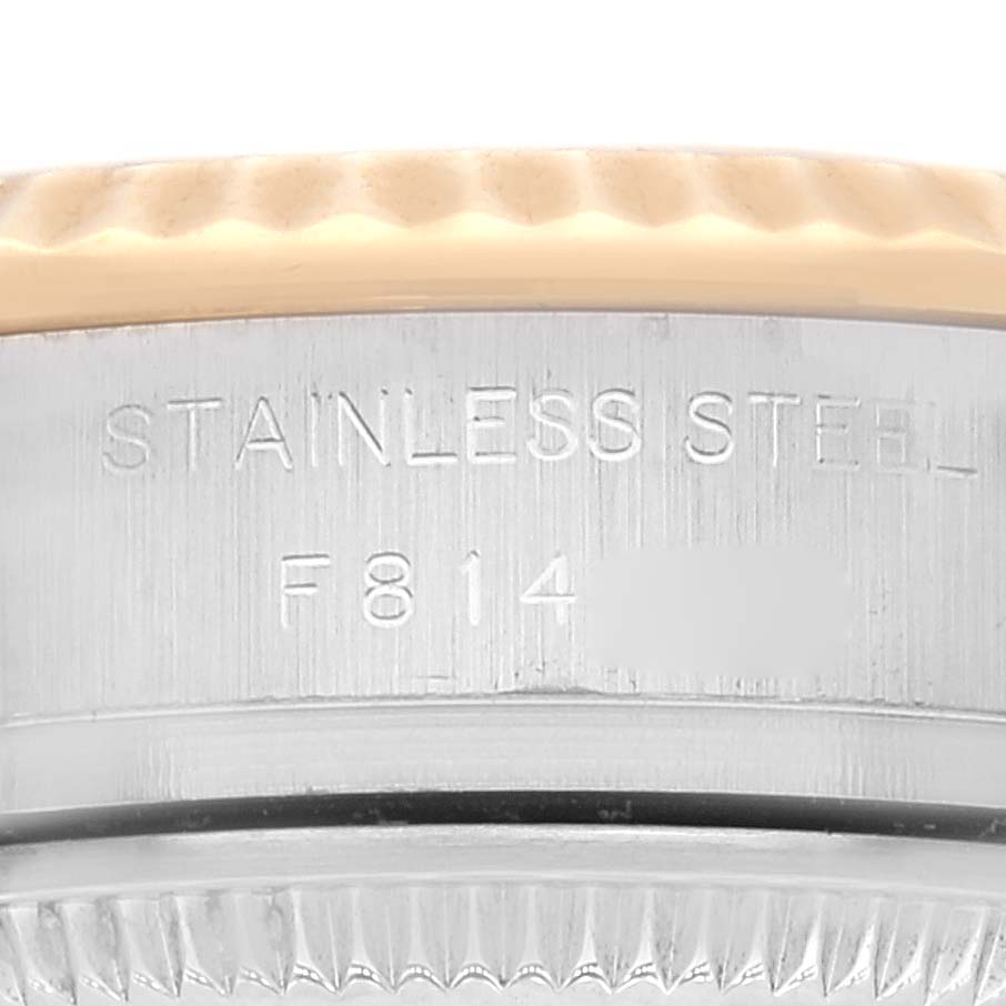 This image shows a close-up of the stainless steel casing and serial number area of a Rolex Datejust 179173 Women's Steel and Gold (two tone) Champagne Dial 179173 Women's Steel and Gold (two tone) Champagne Dial watch.