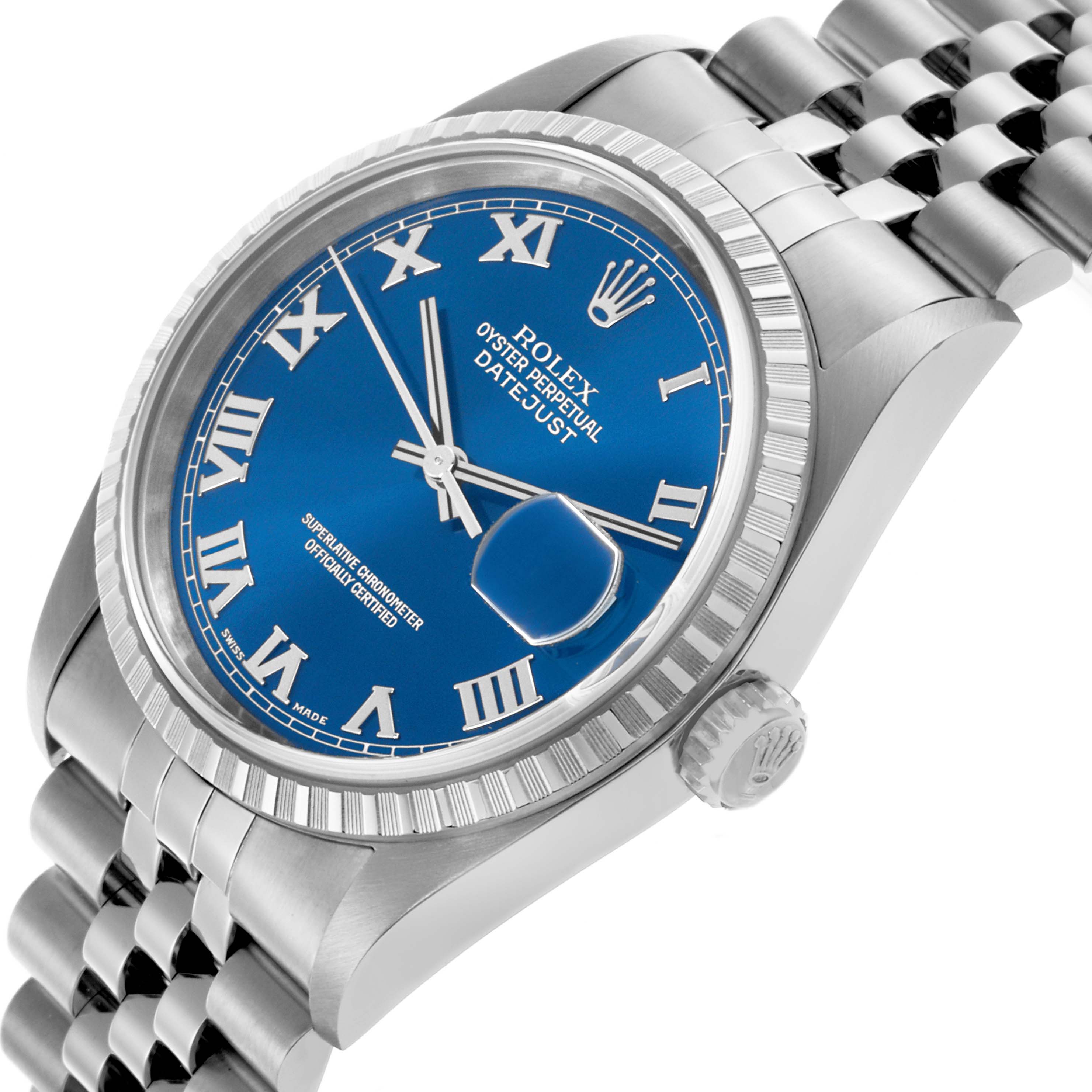The Rolex Datejust 16220 Men's Stainless Steel Blue Dial 16220 Men's Stainless Steel Blue Dial watch is shown from a side angle, highlighting the blue dial, Roman numerals, fluted bezel, and Jubilee bracelet.
