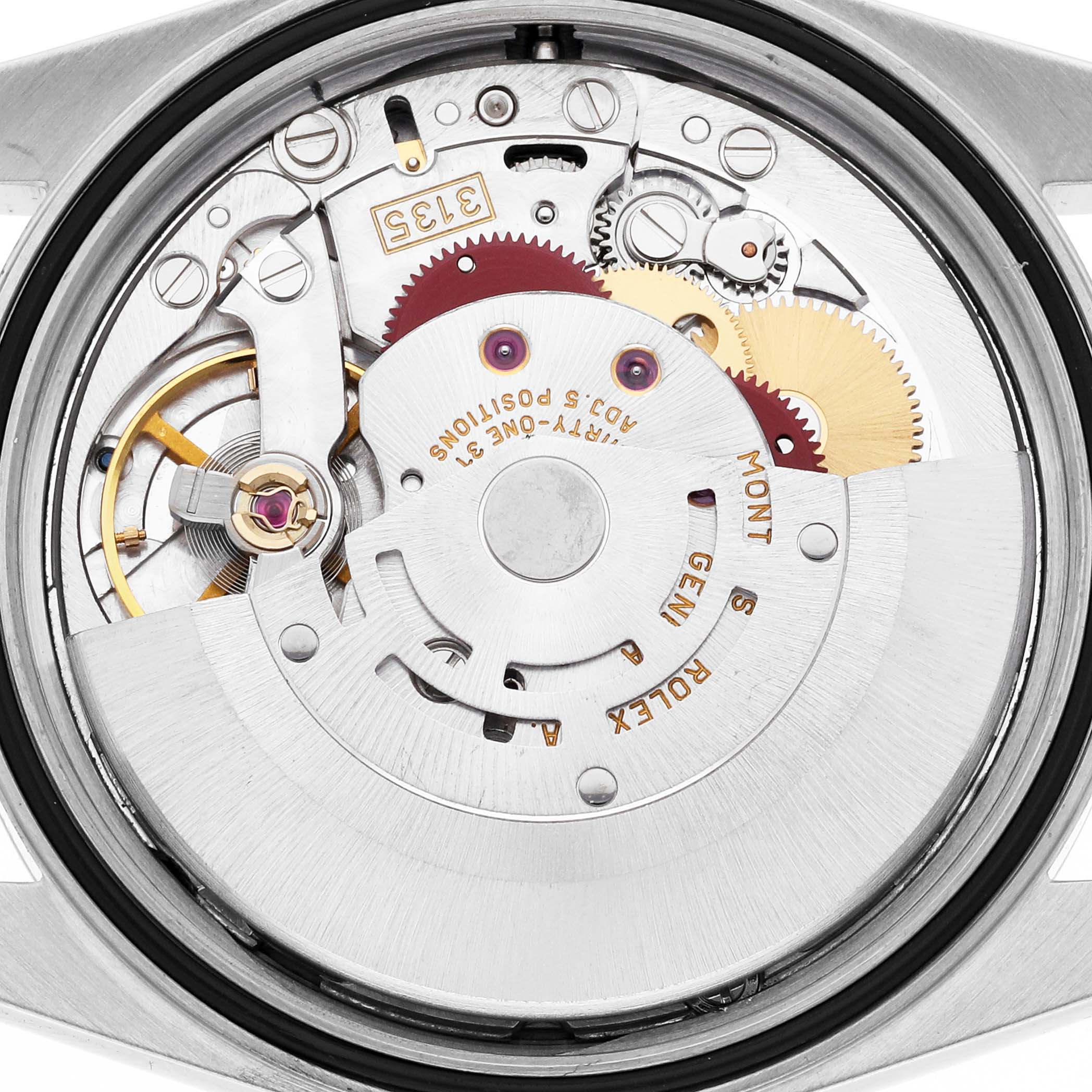 The image shows the movement of a Rolex Datejust 16220 Men's Stainless Steel Blue Dial 16220 Men's Stainless Steel Blue Dial watch viewed from the back, revealing gears and components.