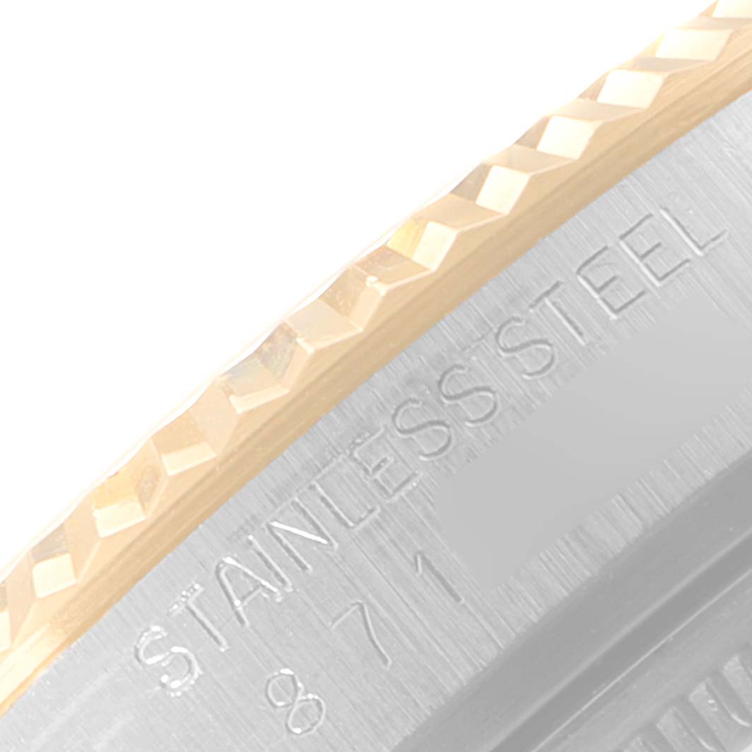 This close-up image shows the side of the bezel and part of the stainless steel case of a Rolex Vintage Collection 16013 Men's Steel and Gold (two tone) Champagne Dial 16013 Men's Steel and Gold (two tone) Champagne Dial watch.
