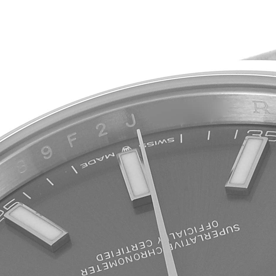 This image shows a close-up of the dial and part of the bezel of the Rolex Datejust 41 126300 Men
s Stainless Steel Grey Dial 126300 Men
s Stainless Steel Grey Dial watch, highlighting the hour markers and text.