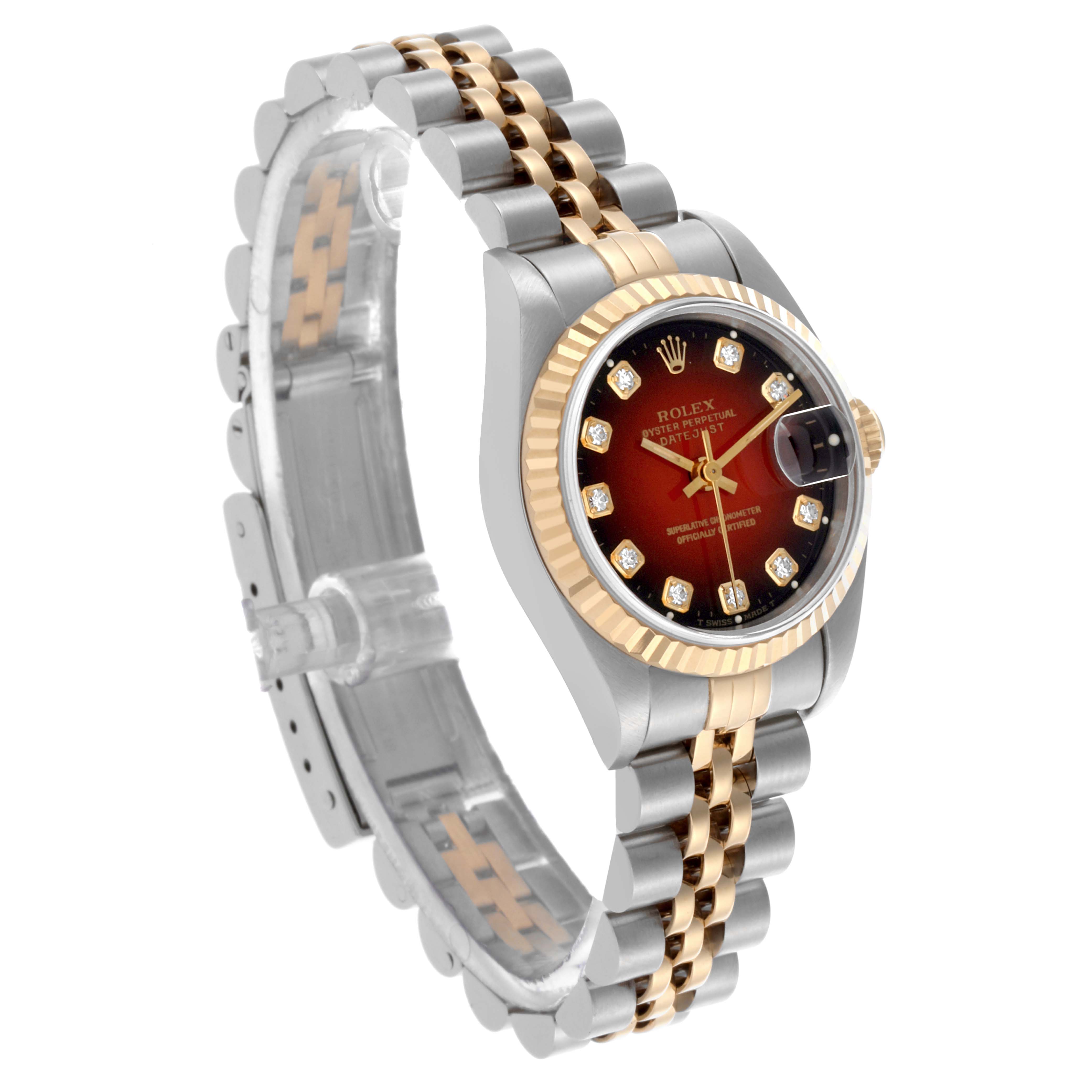 The Rolex Datejust 69173 Women's Steel and Gold (two tone) Red Dial 69173 Women's Steel and Gold (two tone) Red Dial watch is shown at an oblique angle, highlighting its dial, bezel, case, and bracelet.