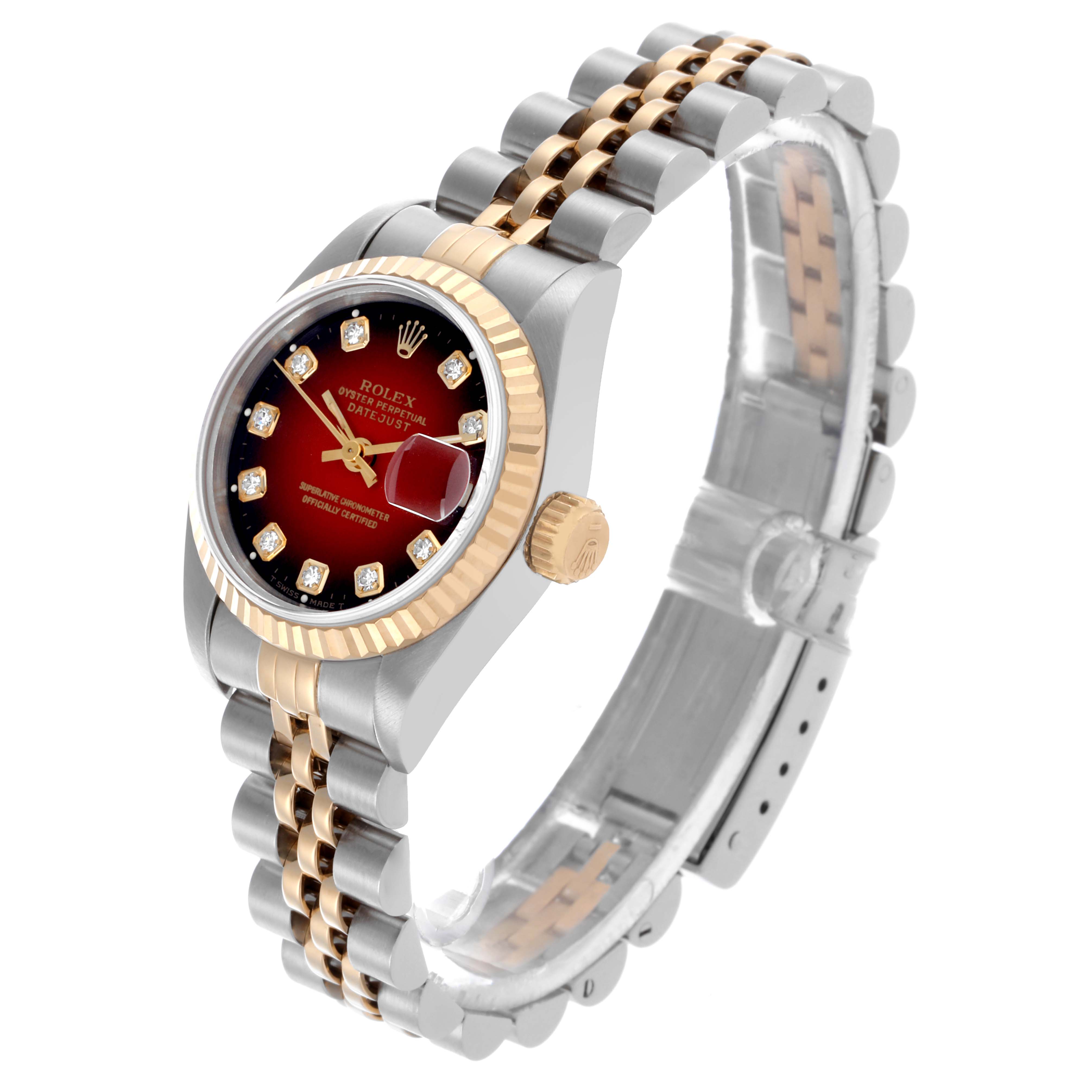The Rolex Datejust 69173 Women's Steel and Gold (two tone) Red Dial 69173 Women's Steel and Gold (two tone) Red Dial watch is angled to show the face, bezel, crown, and the metal bracelet from a three-quarter perspective.