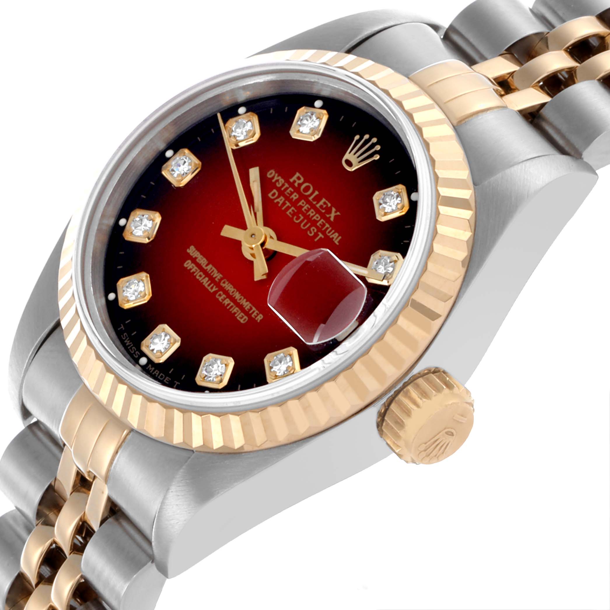 The Rolex Datejust 69173 Women's Steel and Gold (two tone) Red Dial 69173 Women's Steel and Gold (two tone) Red Dial watch is shown at an angled side view, highlighting its bezel, crown, dial, and part of the Jubilee bracelet.