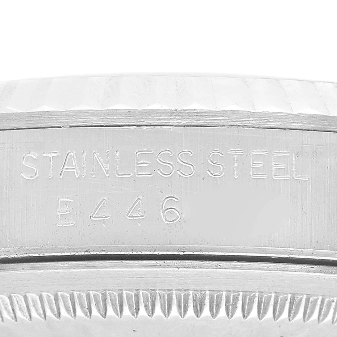 This image shows a close-up of the engraving on the stainless steel casing of a Rolex Datejust 16234 Men's Stainless Steel Silver Dial 16234 Men's Stainless Steel Silver Dial watch.