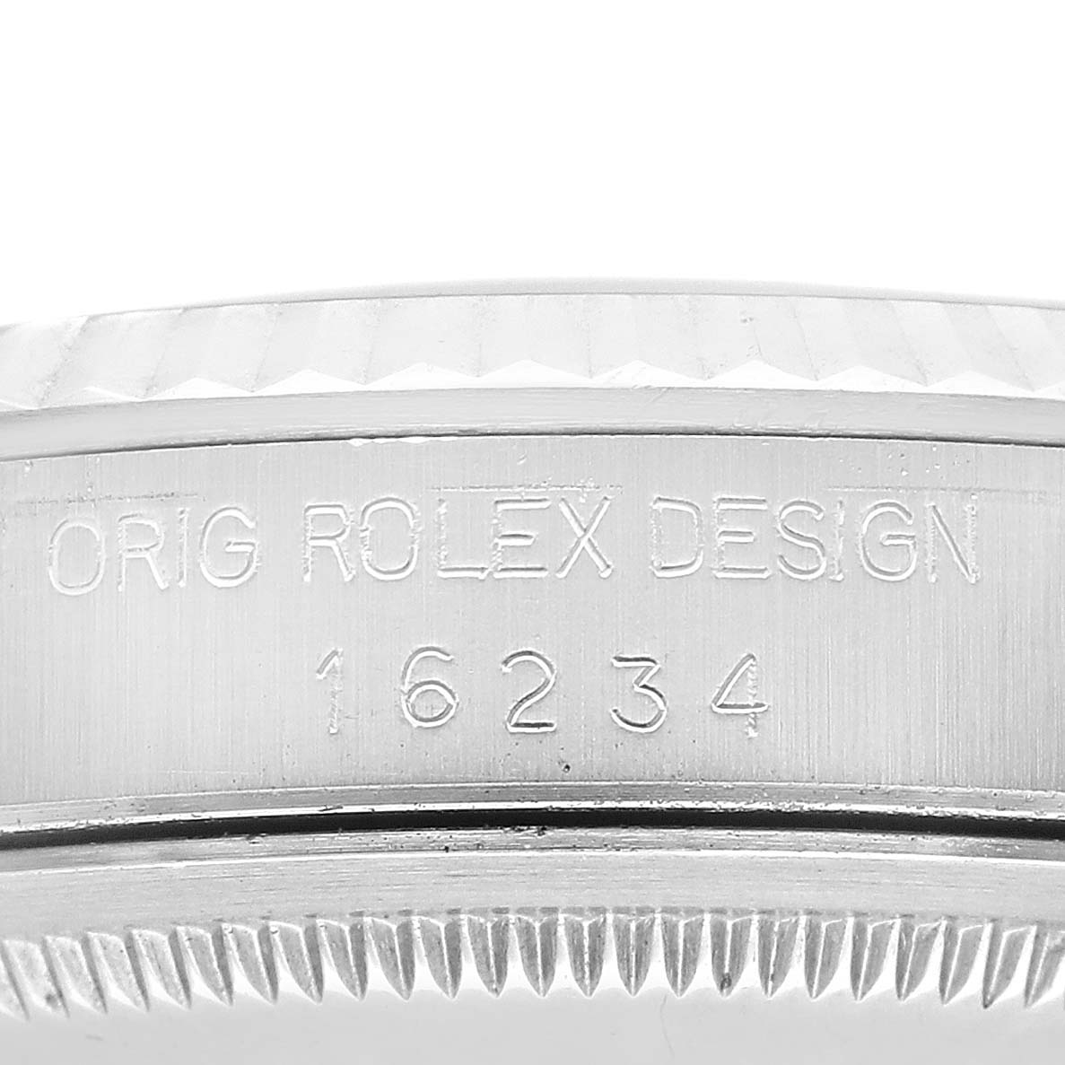 The image shows a close-up of the side of a Rolex Datejust 16234 Men's Stainless Steel Silver Dial 16234 Men's Stainless Steel Silver Dial watch, highlighting the engraved model number "16234" and the text "ORIG ROLEX DESIGN."