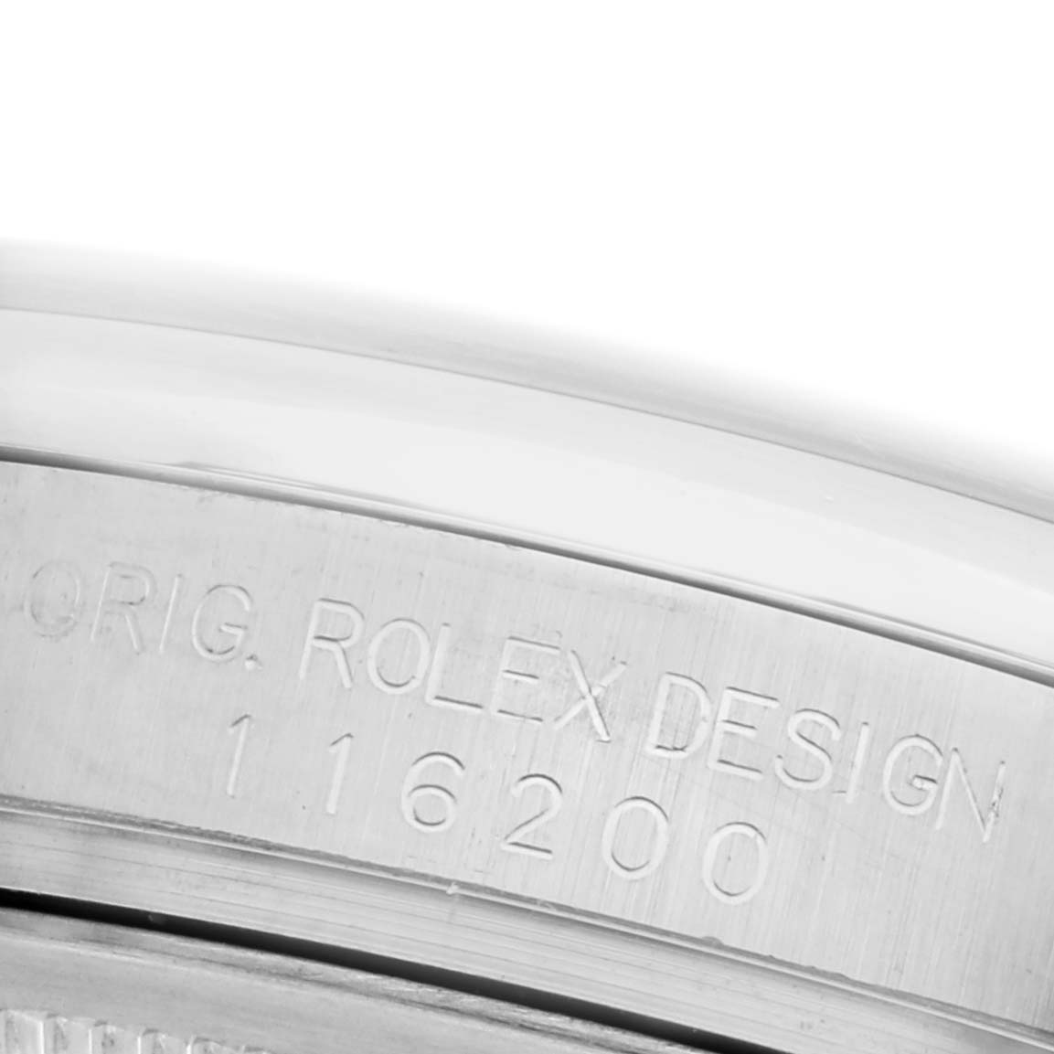 The image shows a close-up of the case back rim of a Rolex Datejust 116200 Men's Stainless Steel Silver Dial 116200 Men's Stainless Steel Silver Dial, highlighting the "Orig. Rolex Design" inscription and model number.