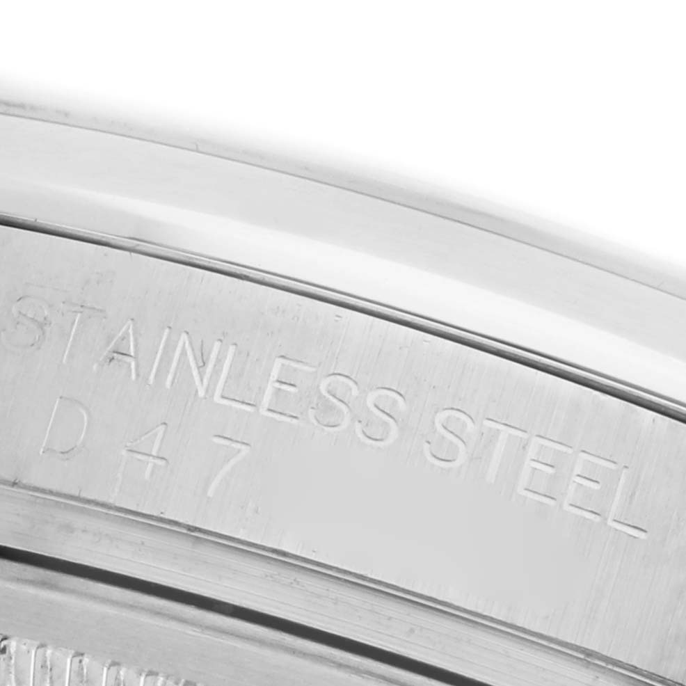 The image shows a close-up of the inner case engraving on a Rolex Datejust 116200 Men's Stainless Steel Silver Dial 116200 Men's Stainless Steel Silver Dial watch bezel, highlighting the "Stainless Steel" inscription.