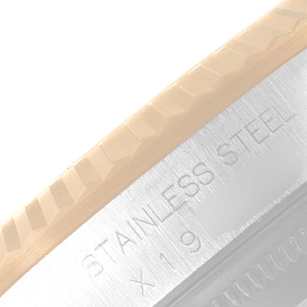 This close-up image shows the fluted bezel and part of the stainless steel casing of the Rolex Datejust 16233 Men's Steel and Gold (two tone) Champagne Dial 16233 Men's Steel and Gold (two tone) Champagne Dial watch.