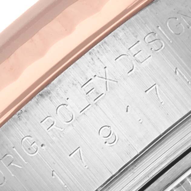 The image shows a close-up of the engraved side of a Rolex Datejust 179171 Women's Steel and Gold (two tone) White Dial 179171 Women's Steel and Gold (two tone) White Dial case, highlighting the brand's markings.