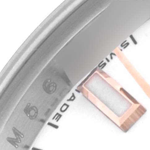 The image shows a close-up of the Rolex Datejust 179171 Women's Steel and Gold (two tone) White Dial 179171 Women's Steel and Gold (two tone) White Dial, highlighting part of the dial, indices, and the watch's inner bezel.