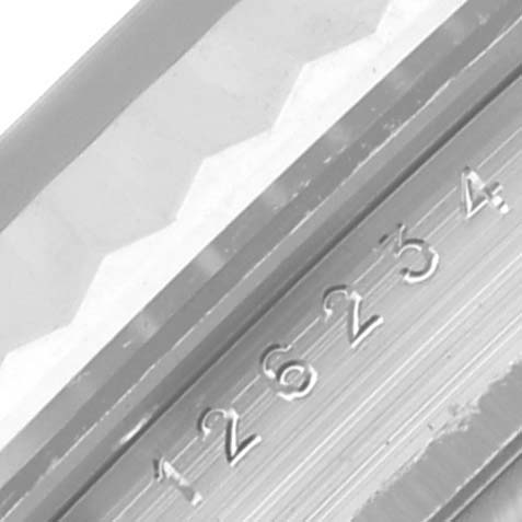 The image shows a close-up of the watch case side, highlighting the embossed serial number of the Rolex Datejust 126234 Men's Stainless Steel Blue Dial 126234 Men's Stainless Steel Blue Dial.