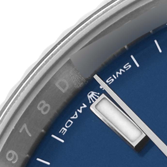 The image shows a close-up of the Rolex Datejust 126234 Men's Stainless Steel Blue Dial 126234 Men's Stainless Steel Blue Dial's blue dial, bezel, and hour markers at an oblique angle.