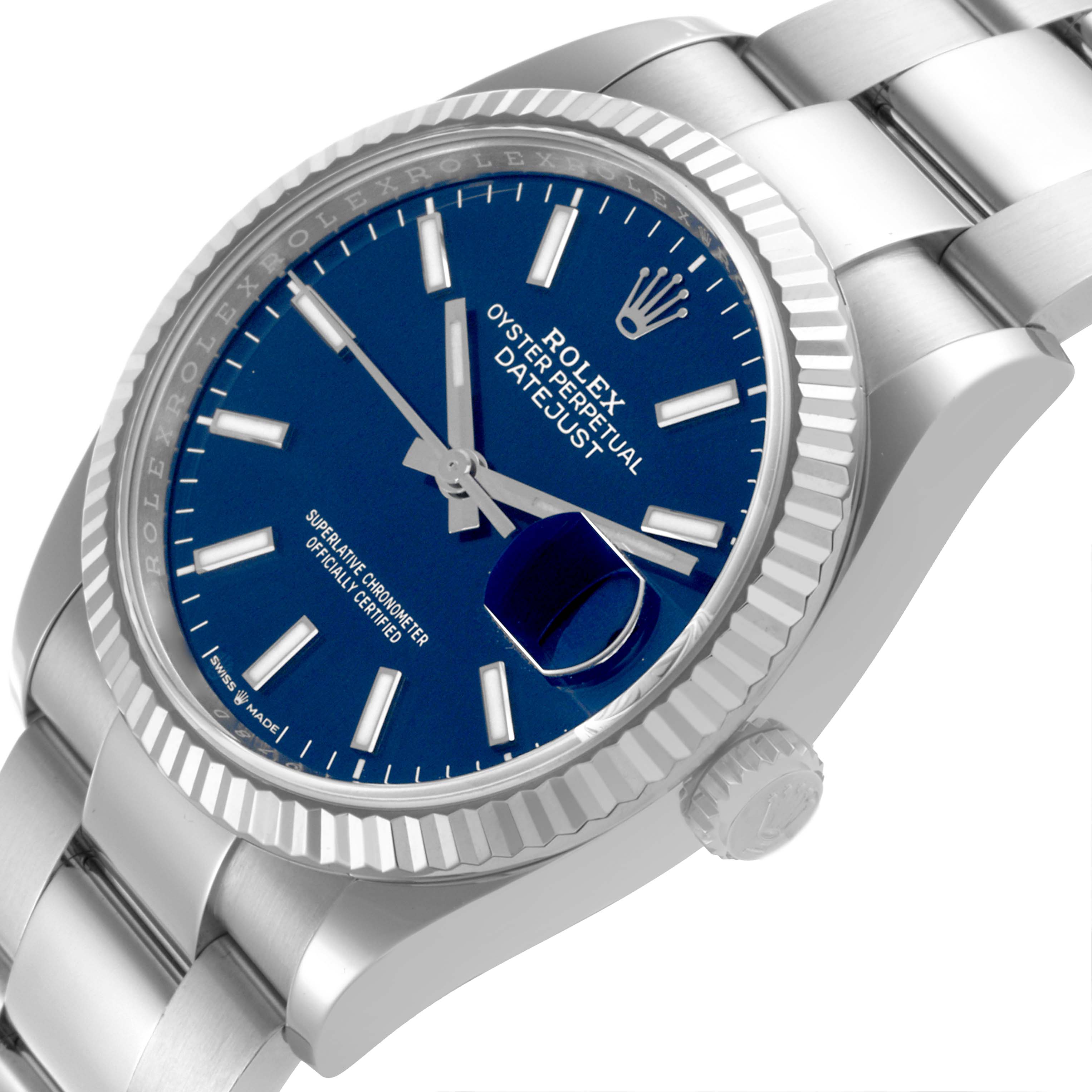 The Rolex Datejust 126234 Men's Stainless Steel Blue Dial 126234 Men's Stainless Steel Blue Dial watch is shown at an angled view, displaying the bezel, crown, and a partial bracelet.