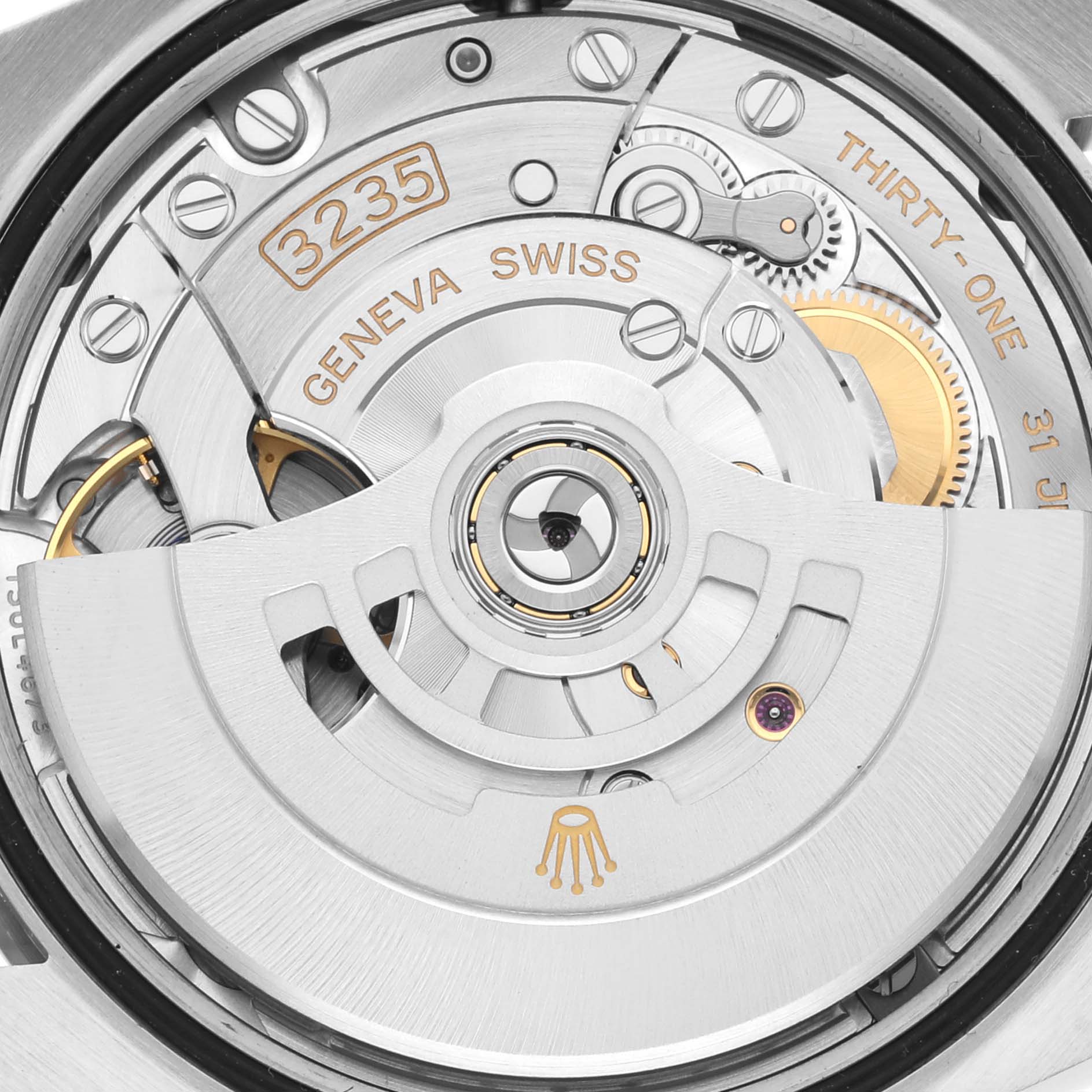 The image shows a close-up view of the Rolex Datejust 126234 Men's Stainless Steel Blue Dial 126234 Men's Stainless Steel Blue Dial's automatic movement, highlighting its rotor and internal components.