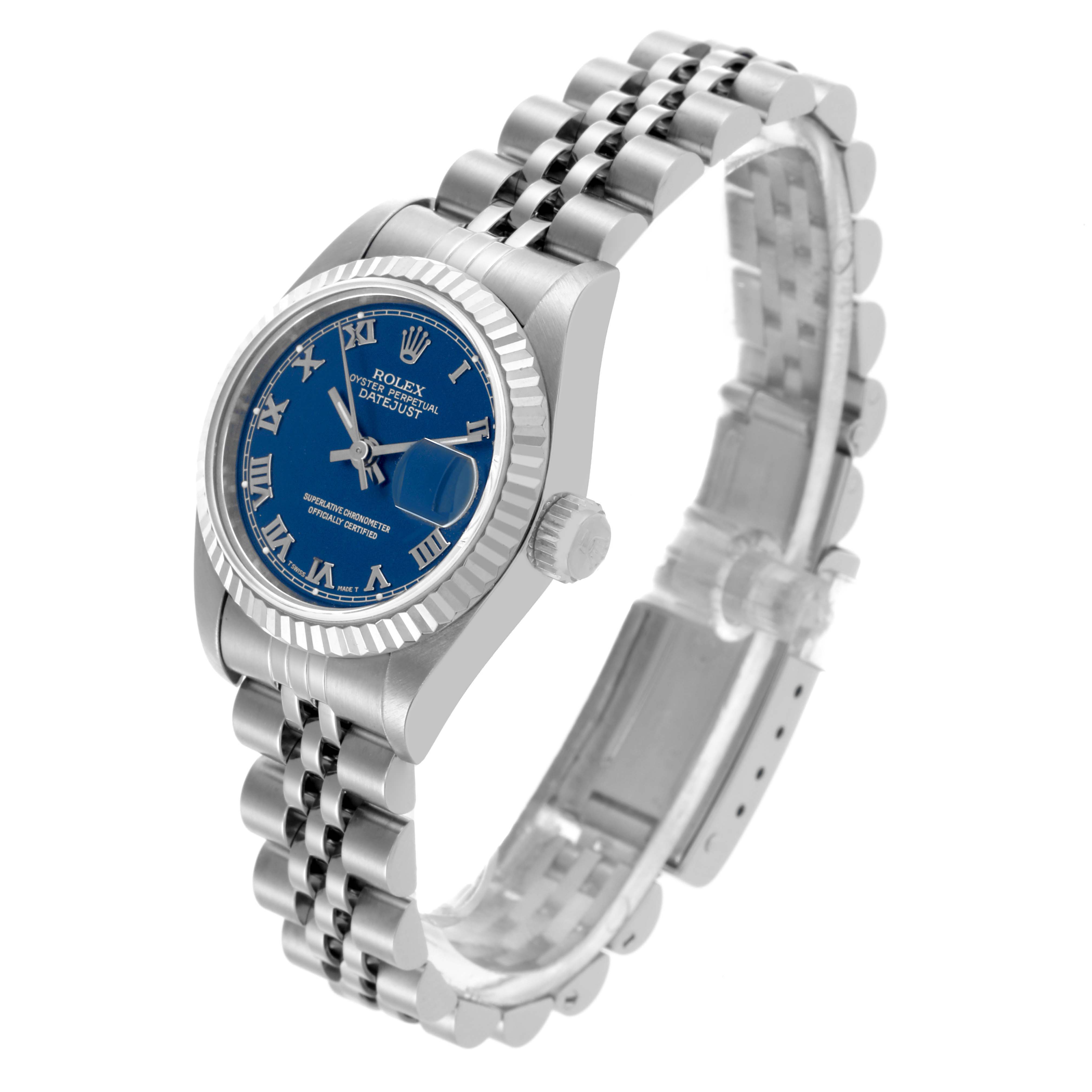 This Rolex Datejust 69174 Women's Stainless Steel Blue Dial 69174 Women's Stainless Steel Blue Dial watch is shown from a side angle, displaying the case, blue dial with Roman numerals, bezel, and bracelet.