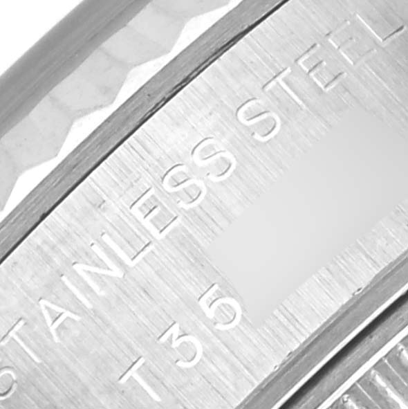 The image shows a close-up of the engraved case back edge of a Rolex Datejust 69174 Women's Stainless Steel Blue Dial 69174 Women's Stainless Steel Blue Dial, highlighting "STAINLESS STEEL."