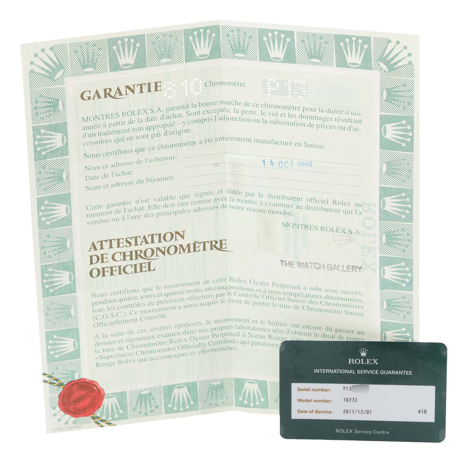 This image shows a Rolex Datejust 16233 Men's Steel and Gold (two tone) Black Dial 16233 Men's Steel and Gold (two tone) Black Dial model's warranty certificate and international service guarantee card.