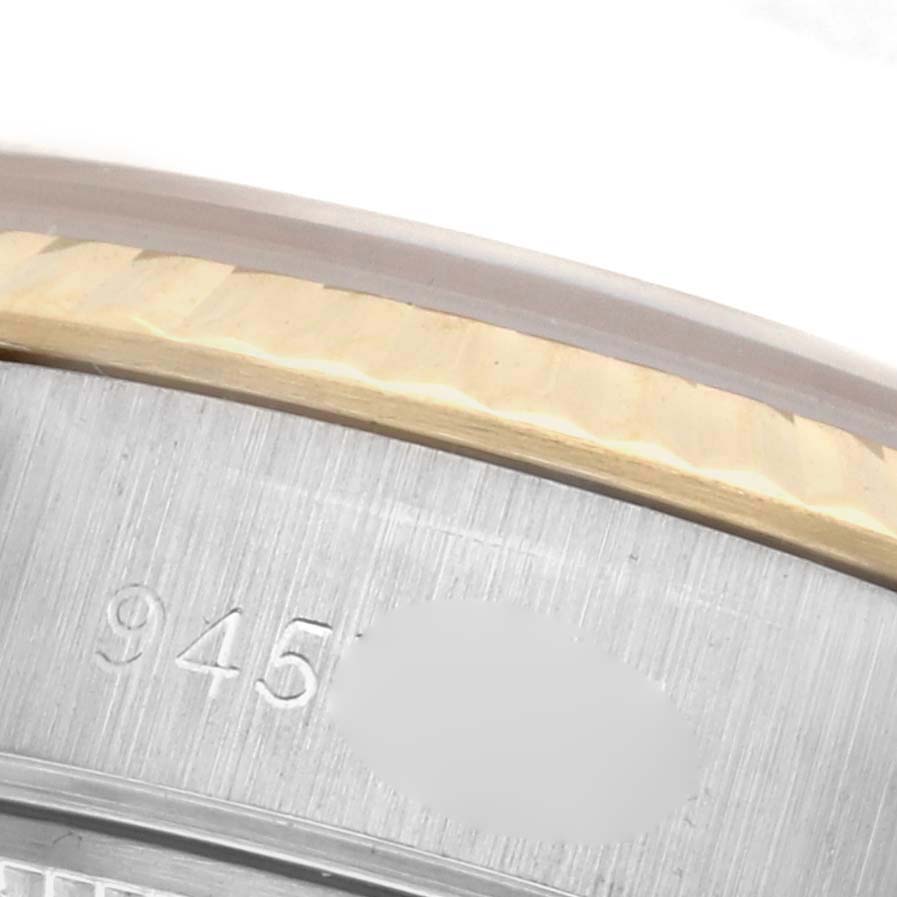 The image shows a close-up of the engraved bezel and edge of the case of a Rolex Datejust 69173 Women's Steel and Gold (two tone) Champagne Dial 69173 Women's Steel and Gold (two tone) Champagne Dial watch.