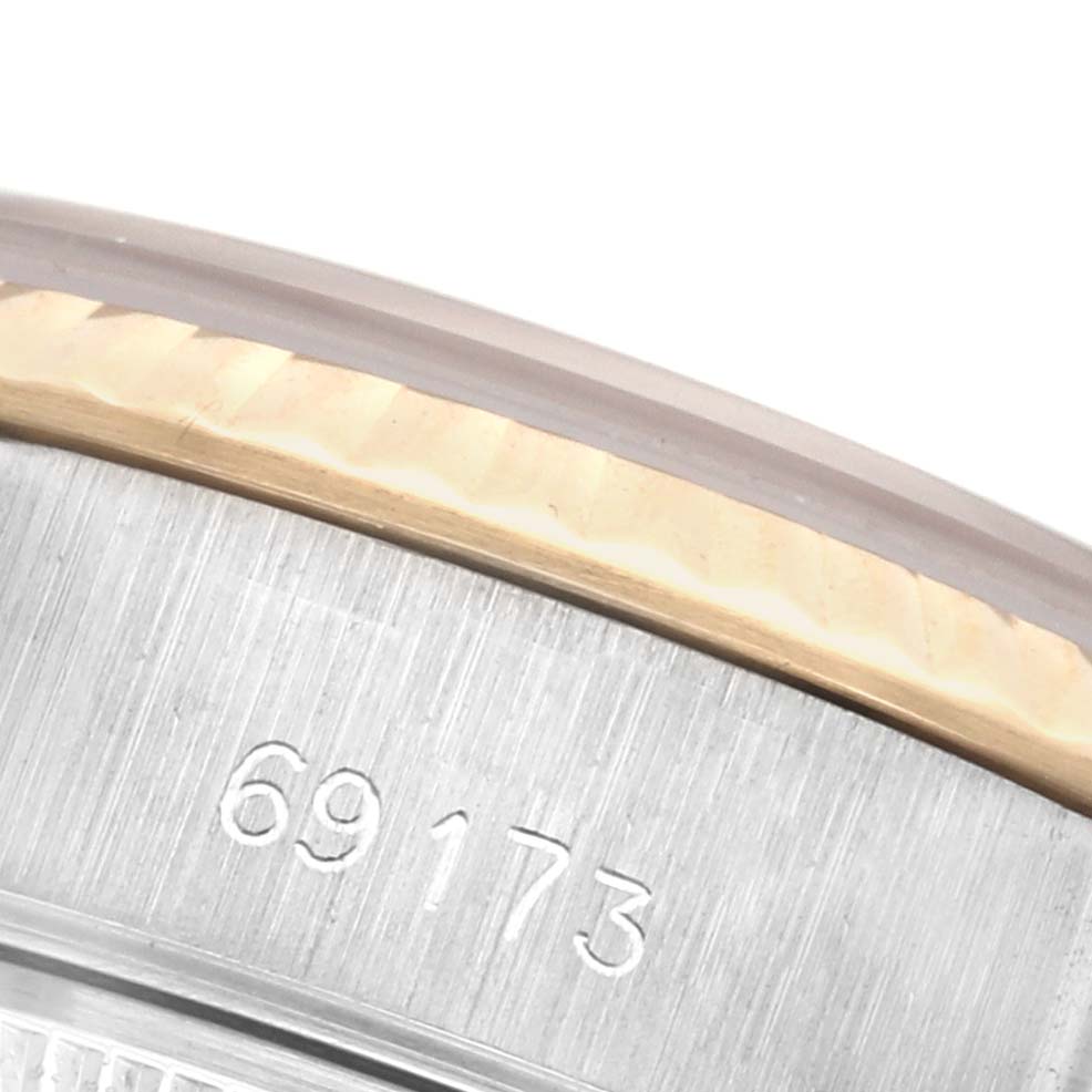 The image shows a close-up of the bezel and case edge of a Rolex Datejust 69173 Women's Steel and Gold (two tone) Champagne Dial 69173 Women's Steel and Gold (two tone) Champagne Dial, focusing on the model number engraving.