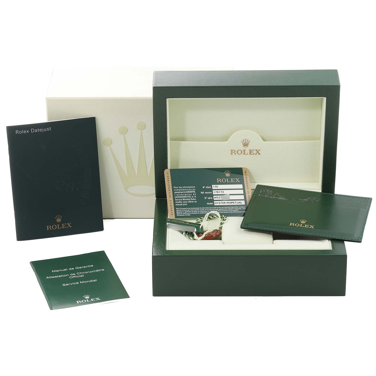 The image shows the packaging for a Rolex Datejust 179173 Women's Steel and Gold (two tone) Silver Dial 179173 Women's Steel and Gold (two tone) Silver Dial watch including manuals, warranty card, and green presentation box.