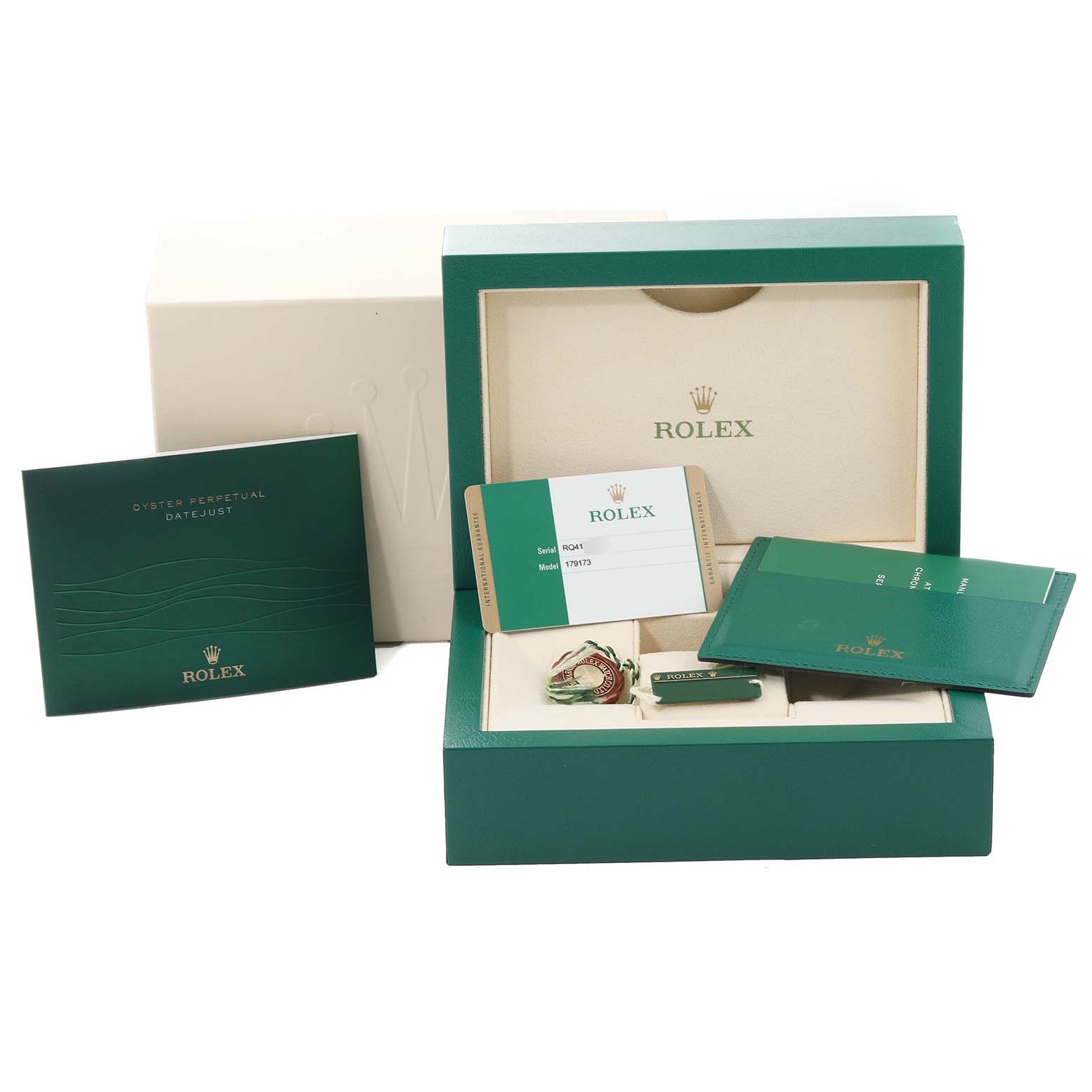 The image shows the packaging and accessories of a Rolex Datejust 179173 Women's Steel and Gold (two tone) Champagne Dial 179173 Women's Steel and Gold (two tone) Champagne Dial, including the watch box, warranty card, booklet, and tags.