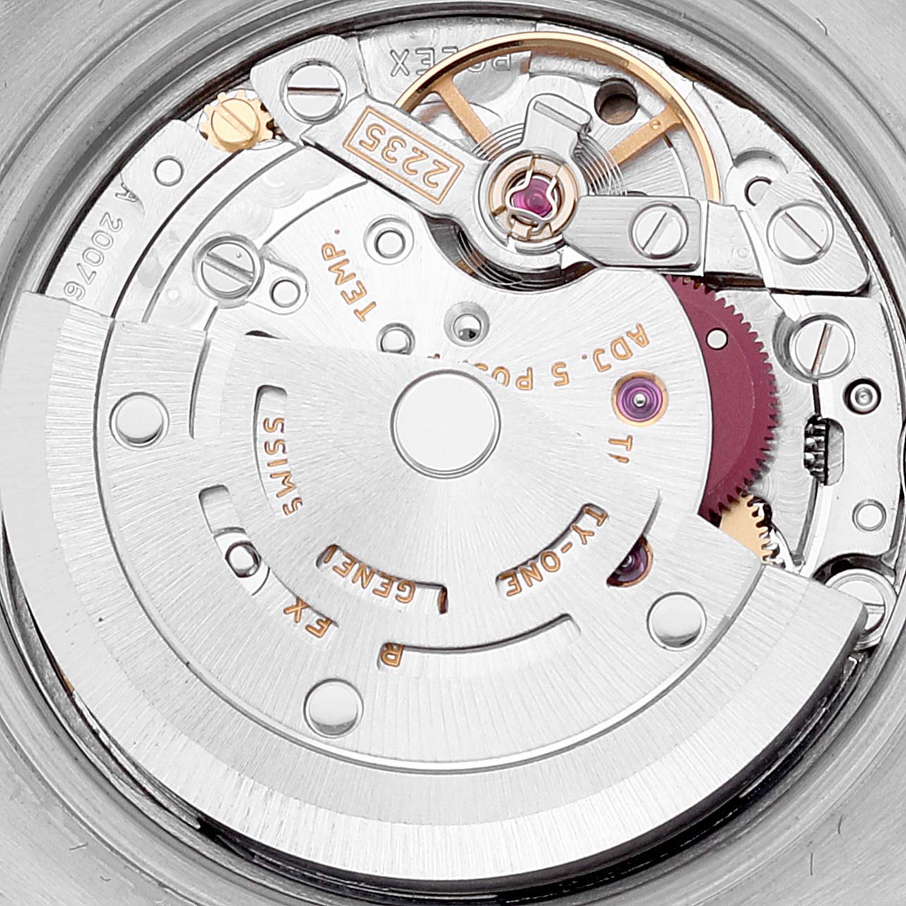 The image shows the intricate internal mechanism of a Rolex Datejust 179173 Women's Steel and Gold (two tone) Blue Dial 179173 Women's Steel and Gold (two tone) Blue Dial watch, focusing on the rotor and other movement components.