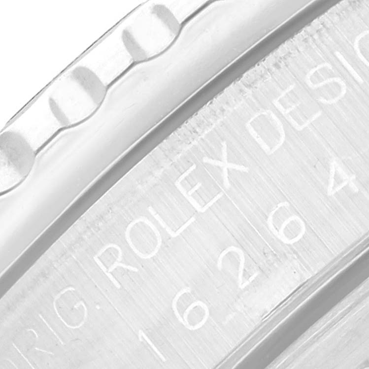 This close-up image focuses on the edge of a Rolex Turn-o-Graph 16264 Men
s Stainless Steel White Dial 16264 Men
s Stainless Steel White Dial model, showing part of the bezel and engraved text.