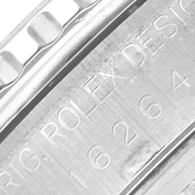 The image shows a close-up of the engraved outer edge of the Rolex Turn-o-Graph 16264 Men's Stainless Steel Silver Dial 16264 Men's Stainless Steel Silver Dial watch case.