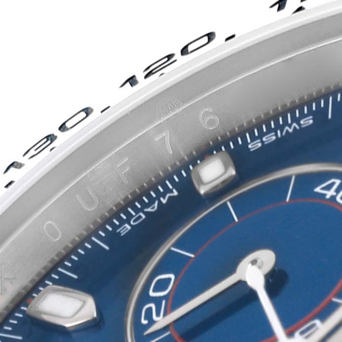 The image shows a close-up of the bezel and part of the dial of a Rolex Daytona 116509 Men's White Gold Blue Dial 116509 Men's White Gold Blue Dial watch.