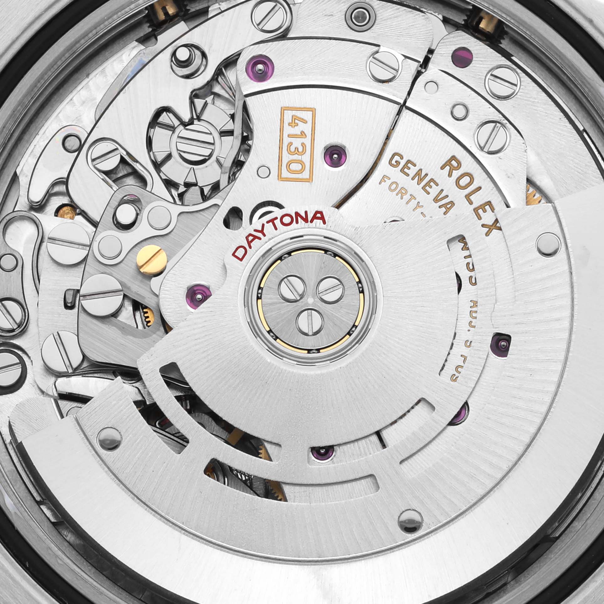 The image shows the movement of a Rolex Daytona 116523 Men
s Steel and Gold (two tone) Black Dial 116523 Men
s Steel and Gold (two tone) Black Dial watch from a bird
s eye view, highlighting gears and engravings.