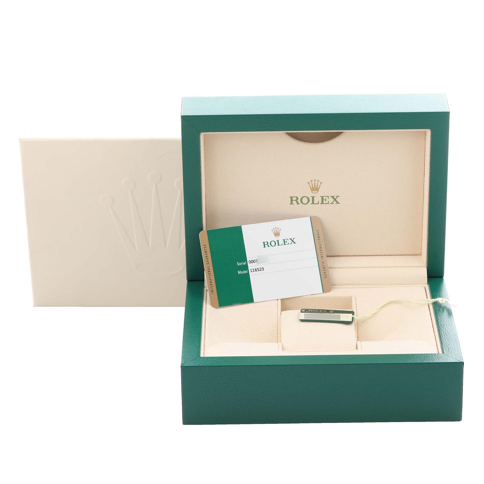 The image shows a Rolex Daytona 116523 Men
s Steel and Gold (two tone) Black Dial 116523 Men
s Steel and Gold (two tone) Black Dial watch box with its warranty card and tag, viewed from the front.