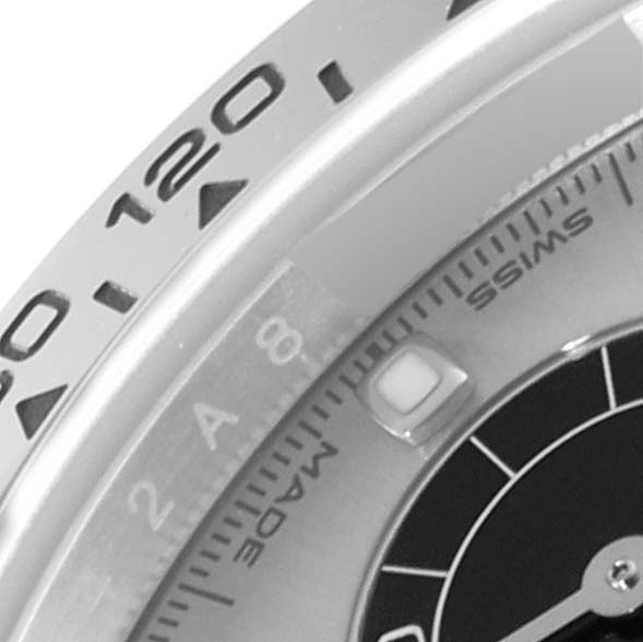 This image shows a close-up of the bezel and dial of a Rolex Daytona 116509 Men's White Gold Silver Dial 116509 Men's White Gold Silver Dial watch, highlighting the tachymeter scale and part of the sub-dial.