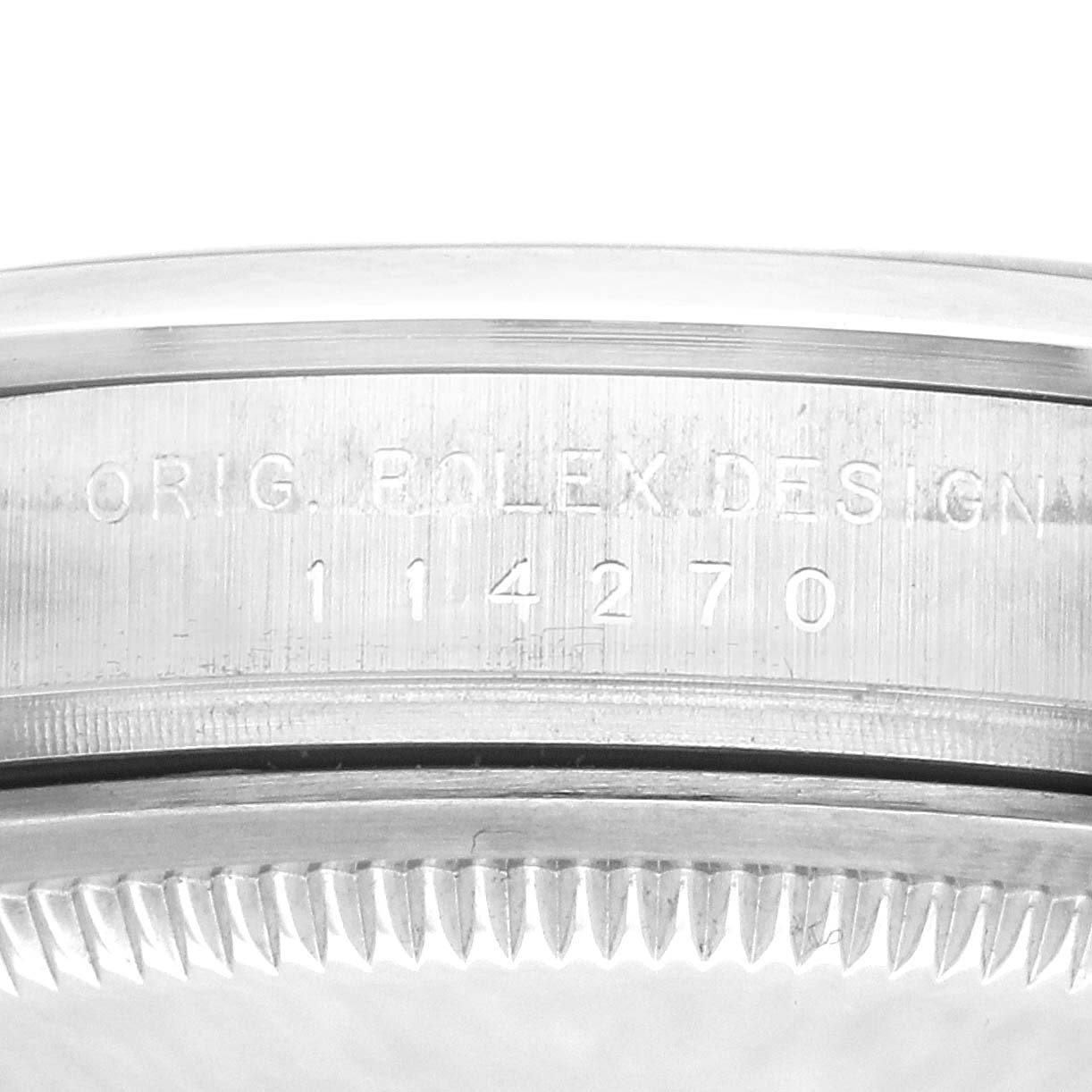 The image shows the side view of a Rolex Explorer 114270 Men's Stainless Steel Black Dial 114270 Men's Stainless Steel Black Dial model, featuring the watch case with engraved text.