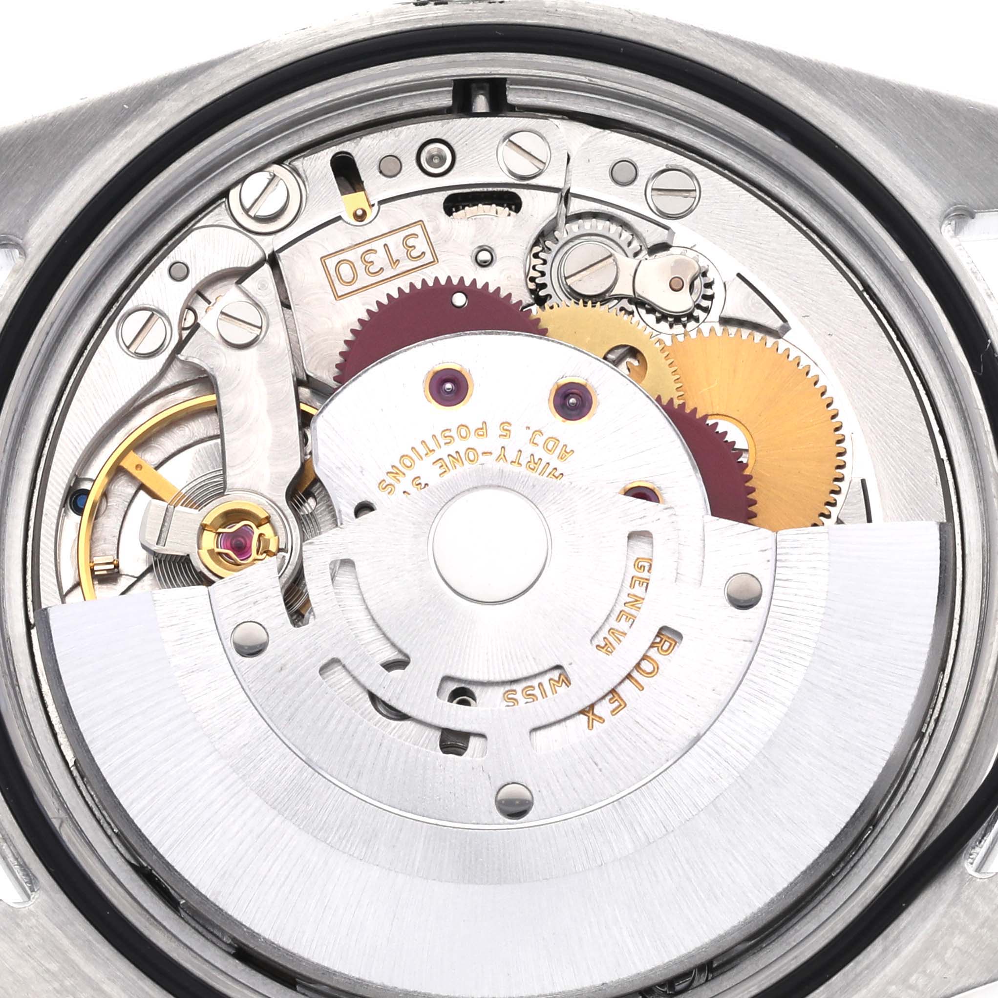 The image shows the movement mechanism of a Rolex Explorer 114270 Men's Stainless Steel Black Dial 114270 Men's Stainless Steel Black Dial, highlighting gears and rotors.