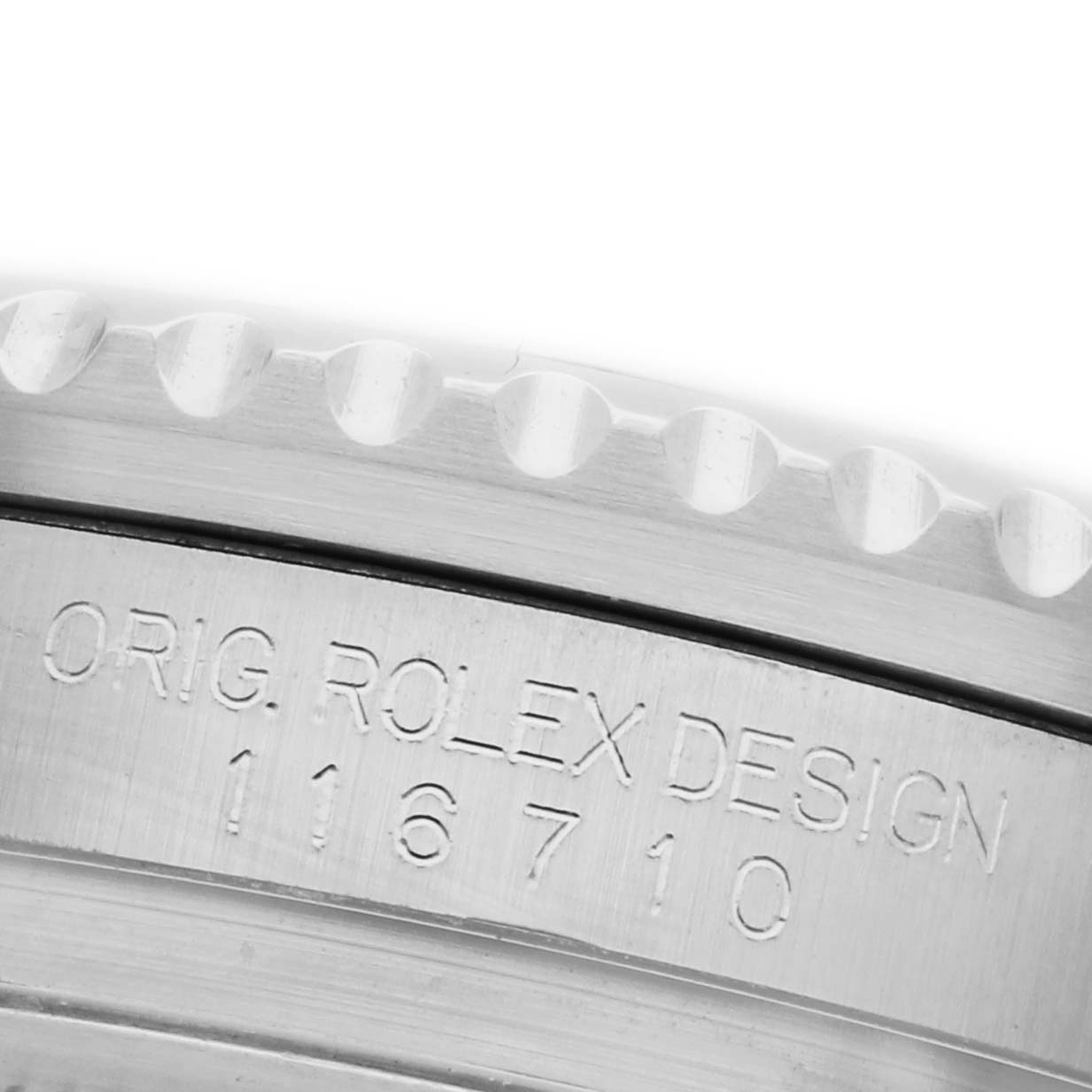 The image shows a close-up of the case side of a Rolex GMT-Master 116710BLNR Men's Stainless Steel Black Dial 116710BLNR Men's Stainless Steel Black Dial, highlighting the model number and engraving.