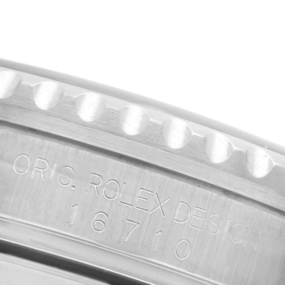 The image shows a close-up of the side of the Rolex GMT-Master 16710 Men's Stainless Steel Black Dial 16710 Men's Stainless Steel Black Dial watch case, highlighting the engraved model number and design details.