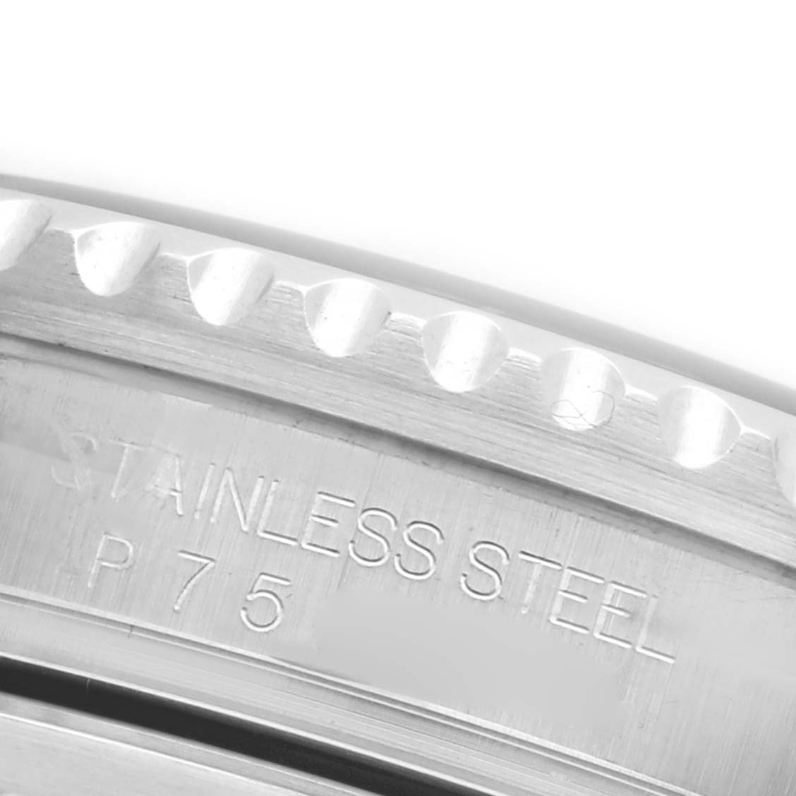 The image shows a close-up angle of the Rolex GMT-Master 16710 Men's Stainless Steel Black Dial 16710 Men's Stainless Steel Black Dial's stainless steel case with engraved details.