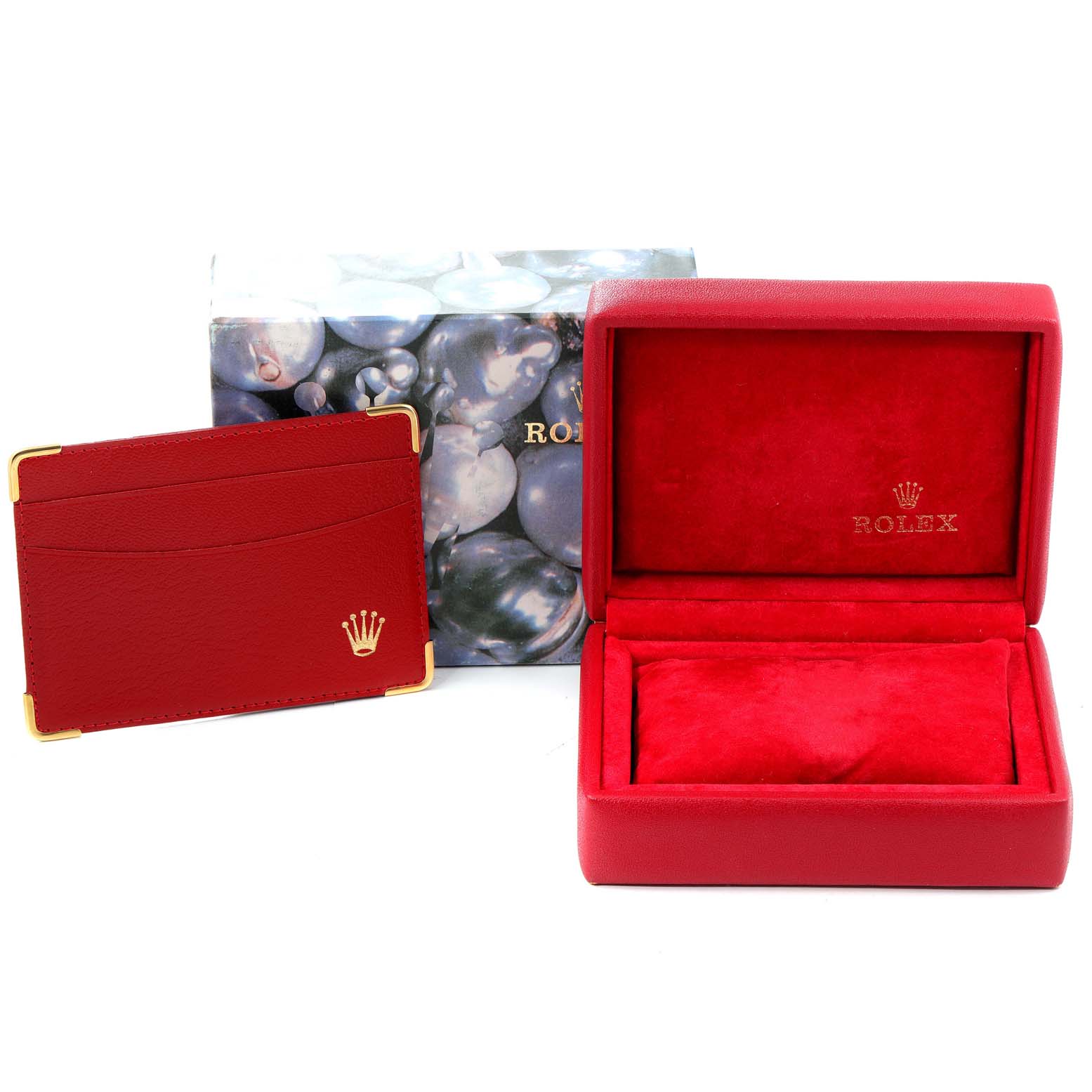 The image shows a red Rolex watch box and accompanying cardholder, designed for the Mid-Size model.