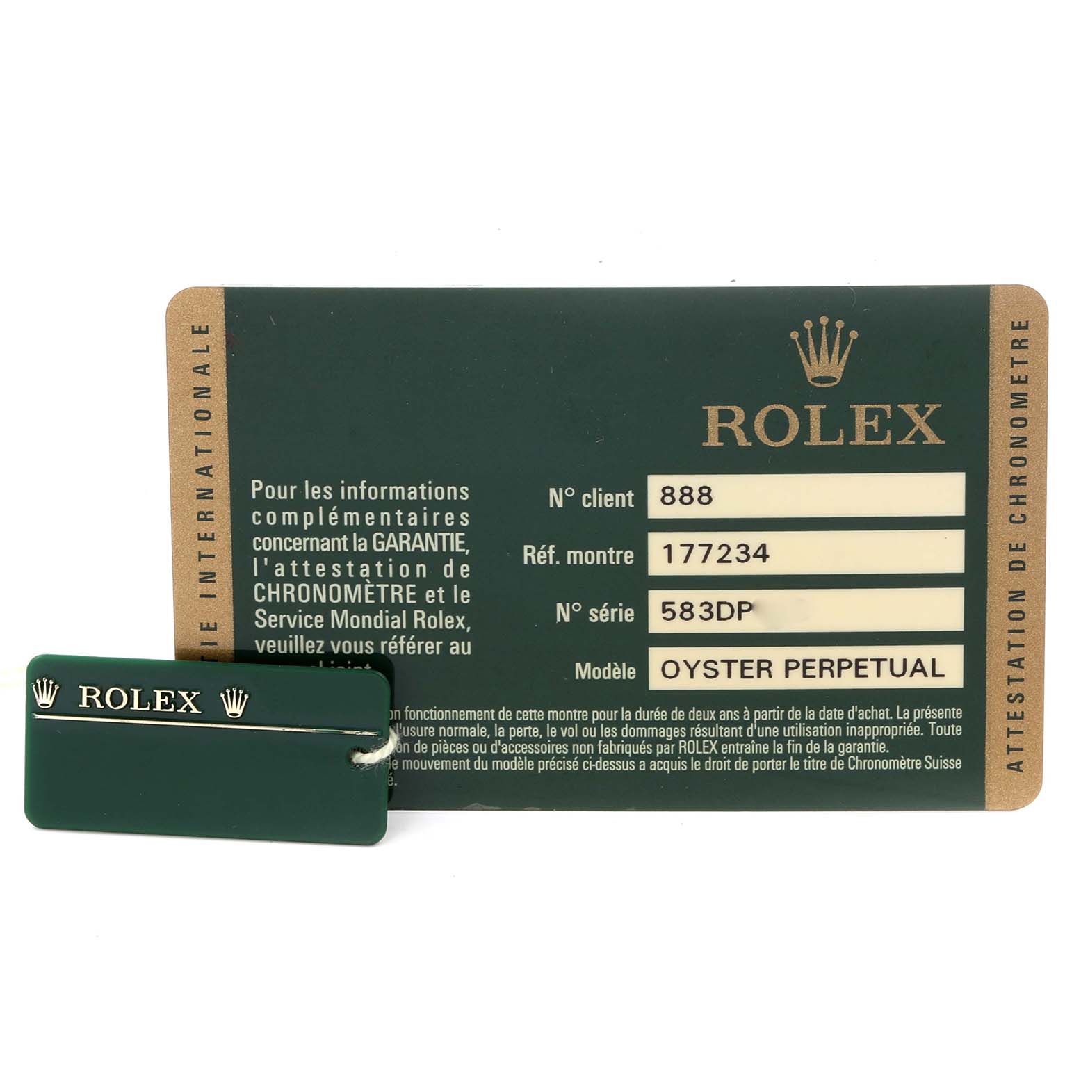 The image shows a Rolex authenticity card and a green Rolex tag for the Mid-Size Oyster Perpetual model.