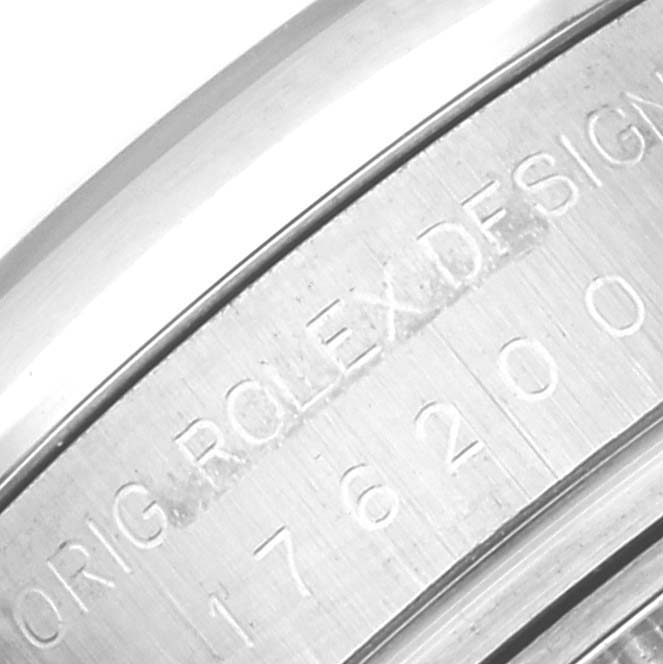 This close-up image shows the engraved case back of a Rolex Oyster Perpetual 176200 Women's Stainless Steel Silver Dial 176200 Women's Stainless Steel Silver Dial watch.