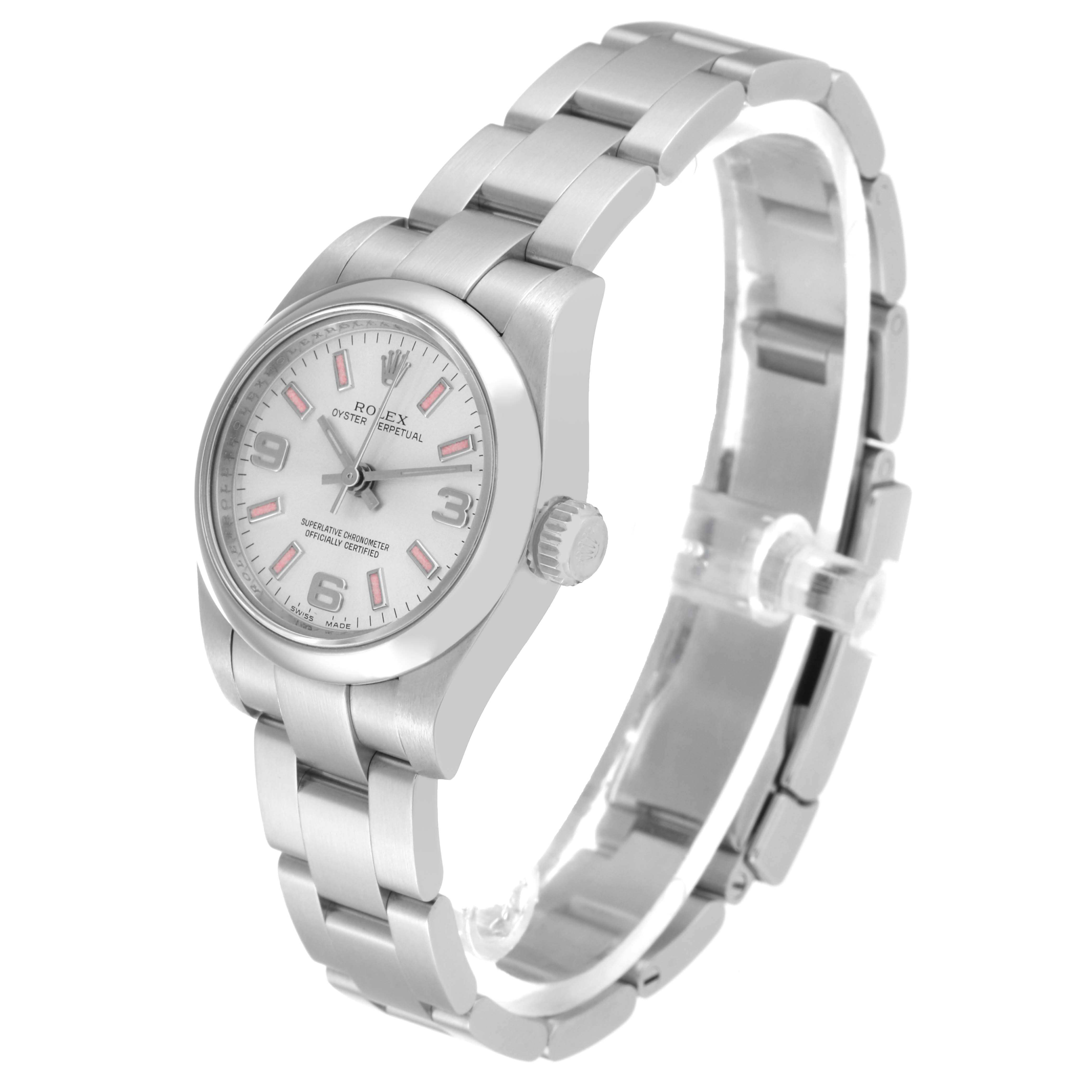 The Oyster Perpetual Rolex watch is shown at a slight angle, highlighting its face, bezel, bracelet, and crown.