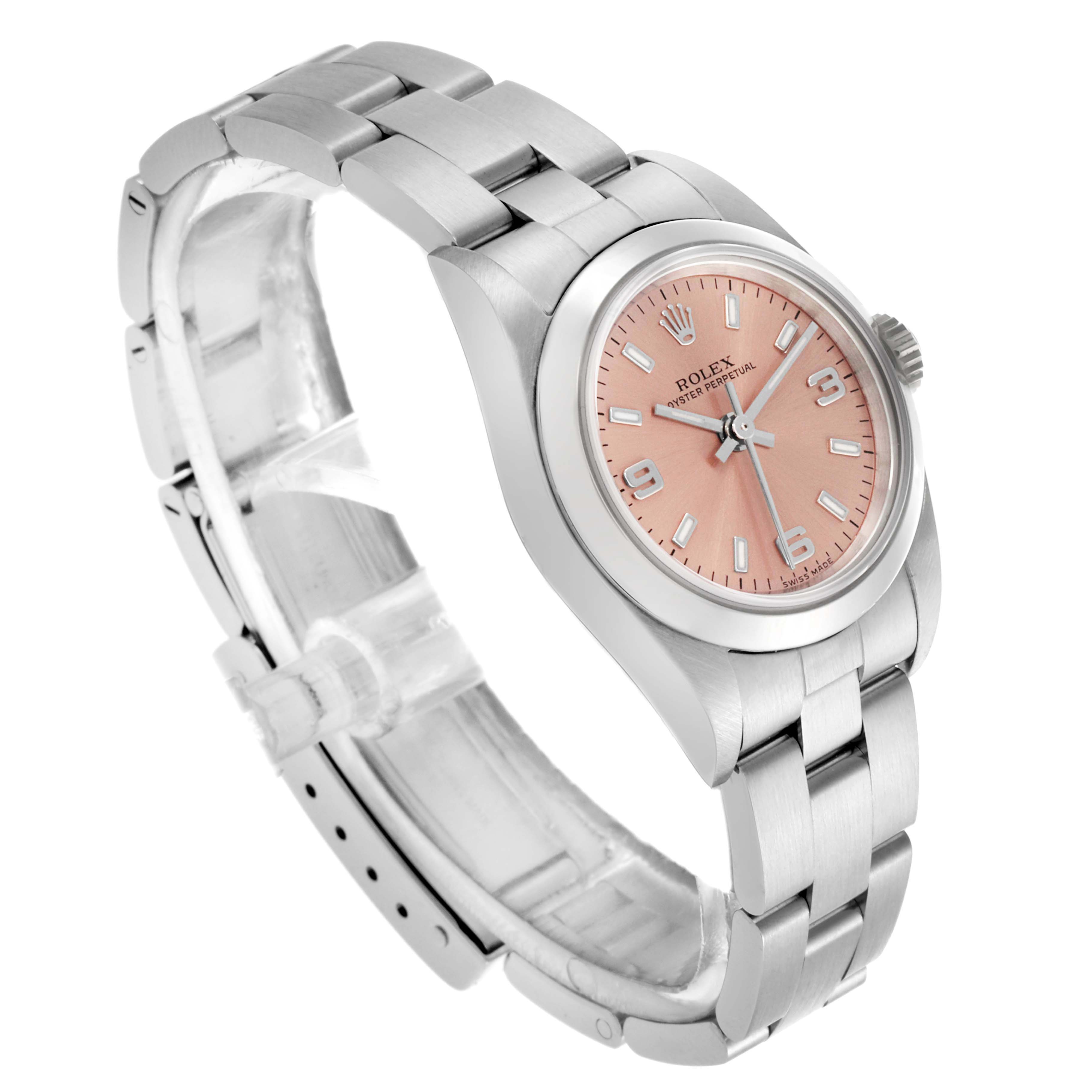 The Rolex Oyster Perpetual 76080 Women's Stainless Steel Pink Dial 76080 Women's Stainless Steel Pink Dial watch is shown at a three-quarter angle, highlighting the face, crown, bezel, and bracelet.