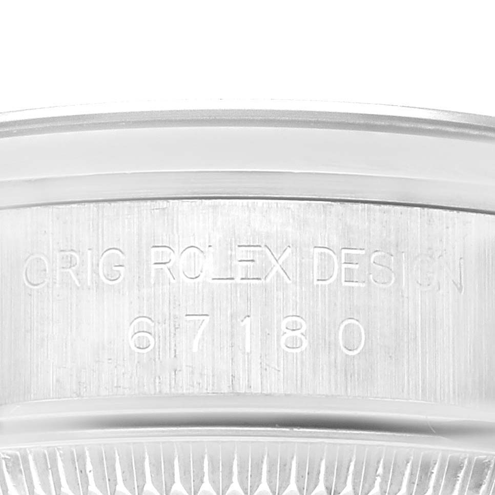 The image shows a close-up of the side of the case body of an Oyster Perpetual Rolex watch, displaying the model number and engraving.