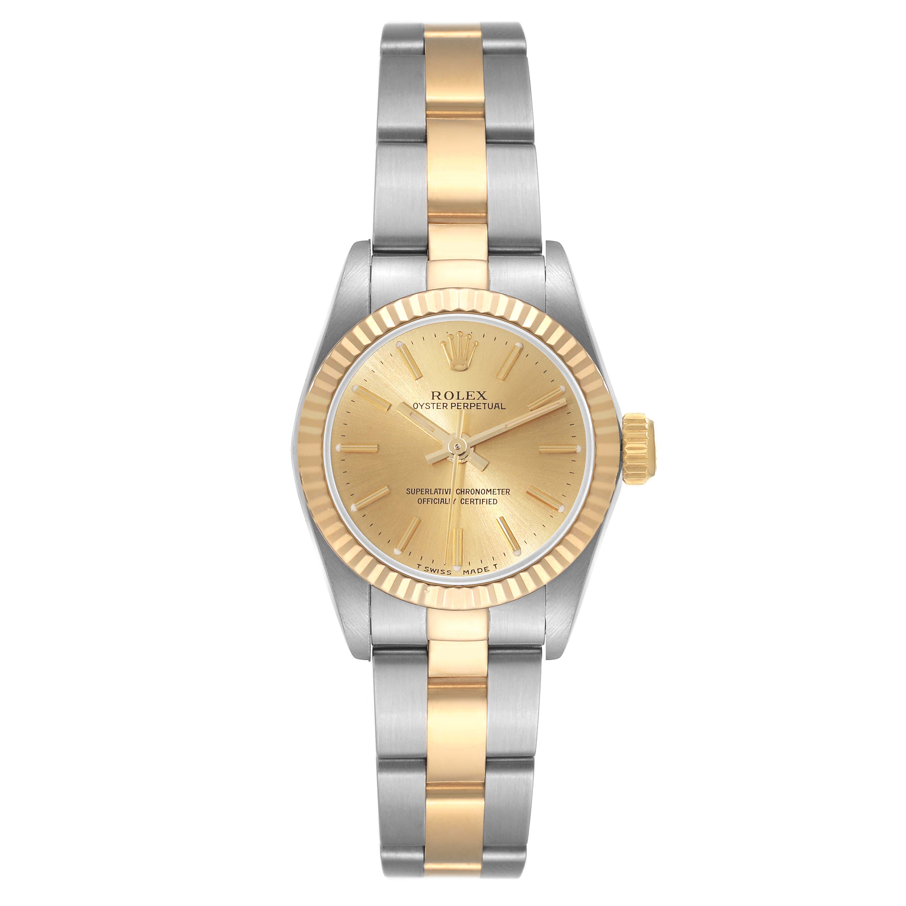 The Rolex Oyster Perpetual 67193 Women's Steel and Gold (two tone) Champagne Dial 67193 Women's Steel and Gold (two tone) Champagne Dial watch is shown from the front, highlighting its two-tone bracelet, gold dial, and fluted bezel.