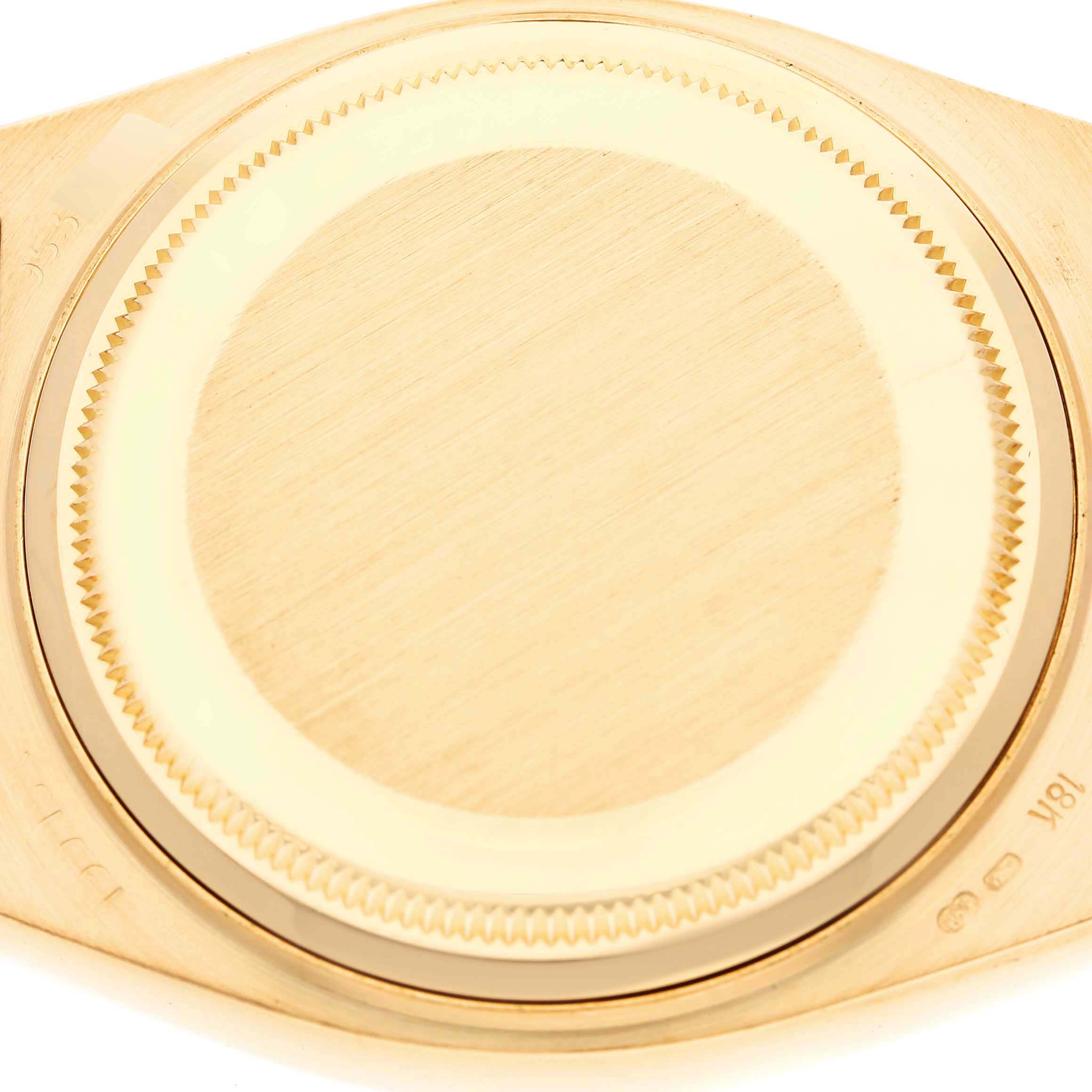 The image shows the case back of a Rolex Oysterquartz 19018 Men's Yellow Gold Champagne Dial 19018 Men's Yellow Gold Champagne Dial model photographed from directly above.